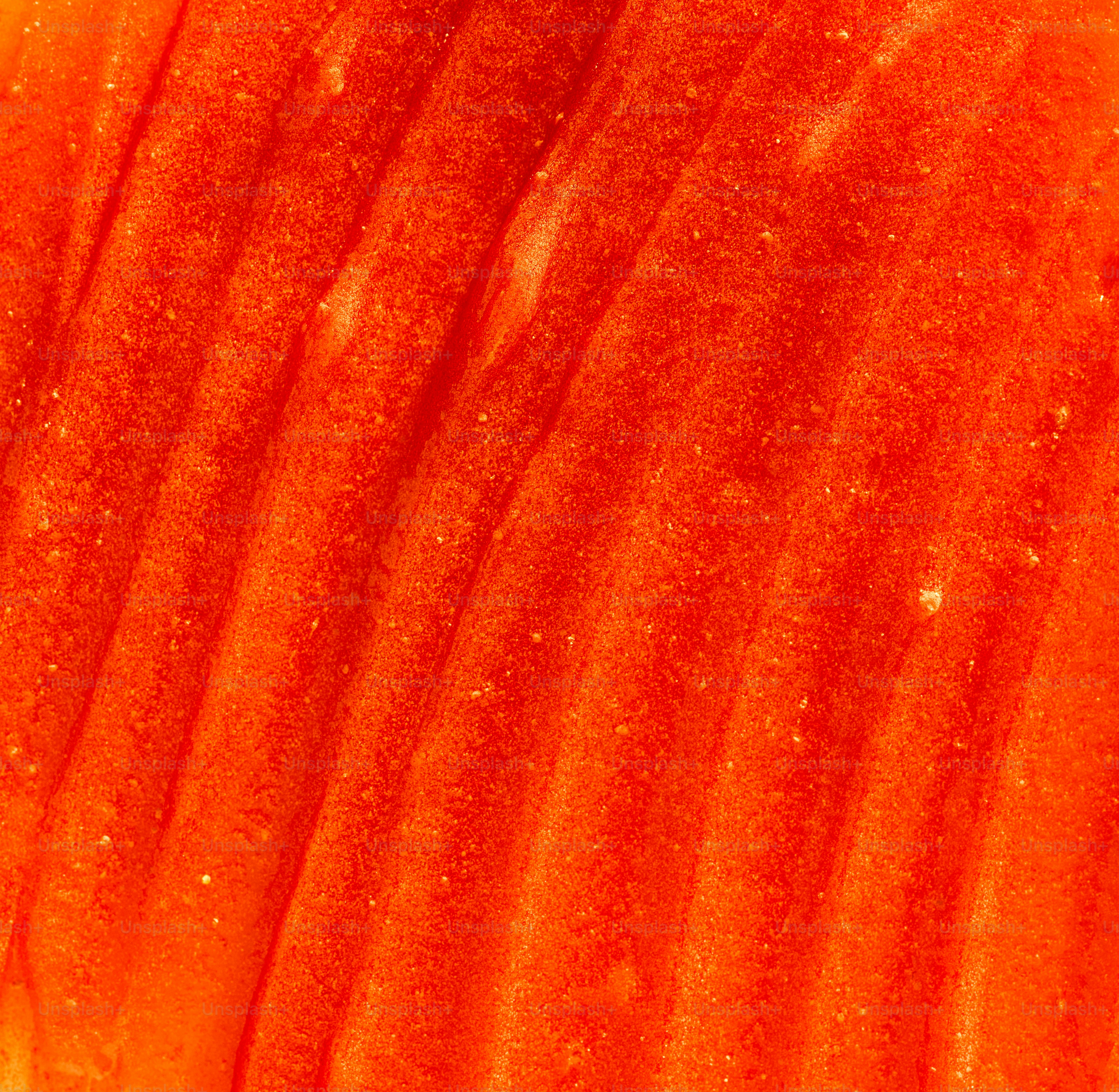 Close-up abstract texture of vibrant orange ridges