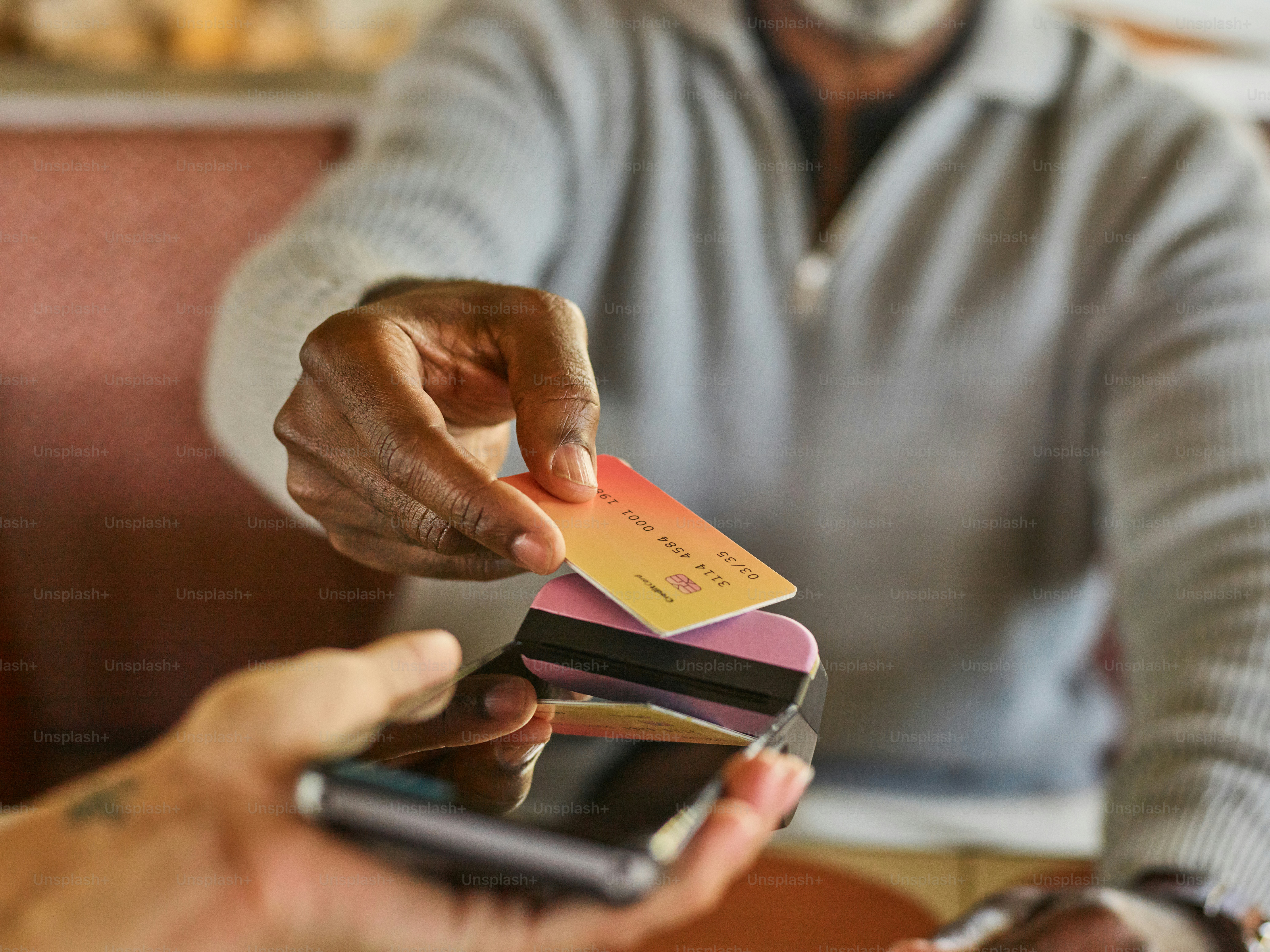 Customer paying with credit card at point of sale.