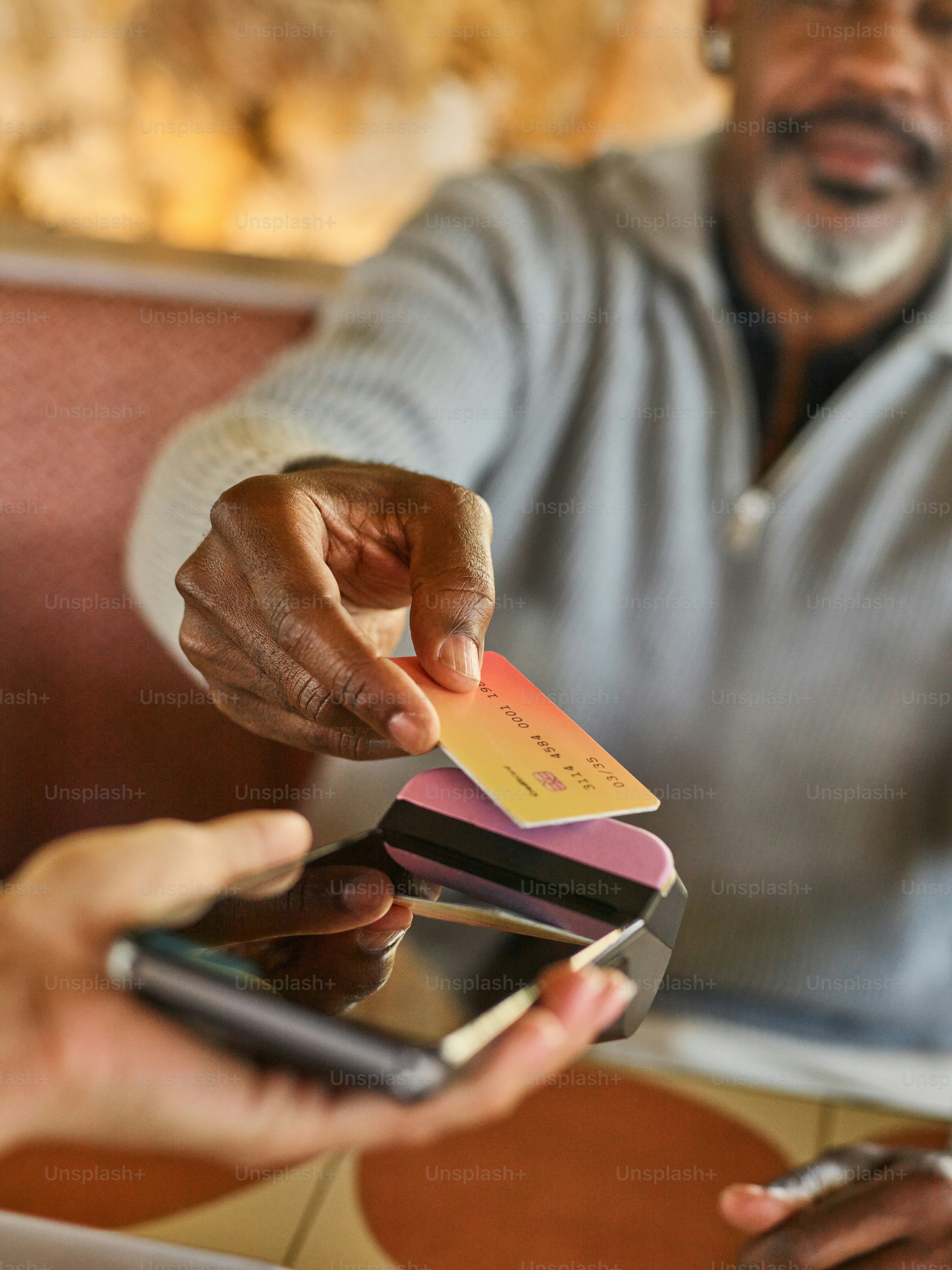 Man paying with credit card at point of sale.