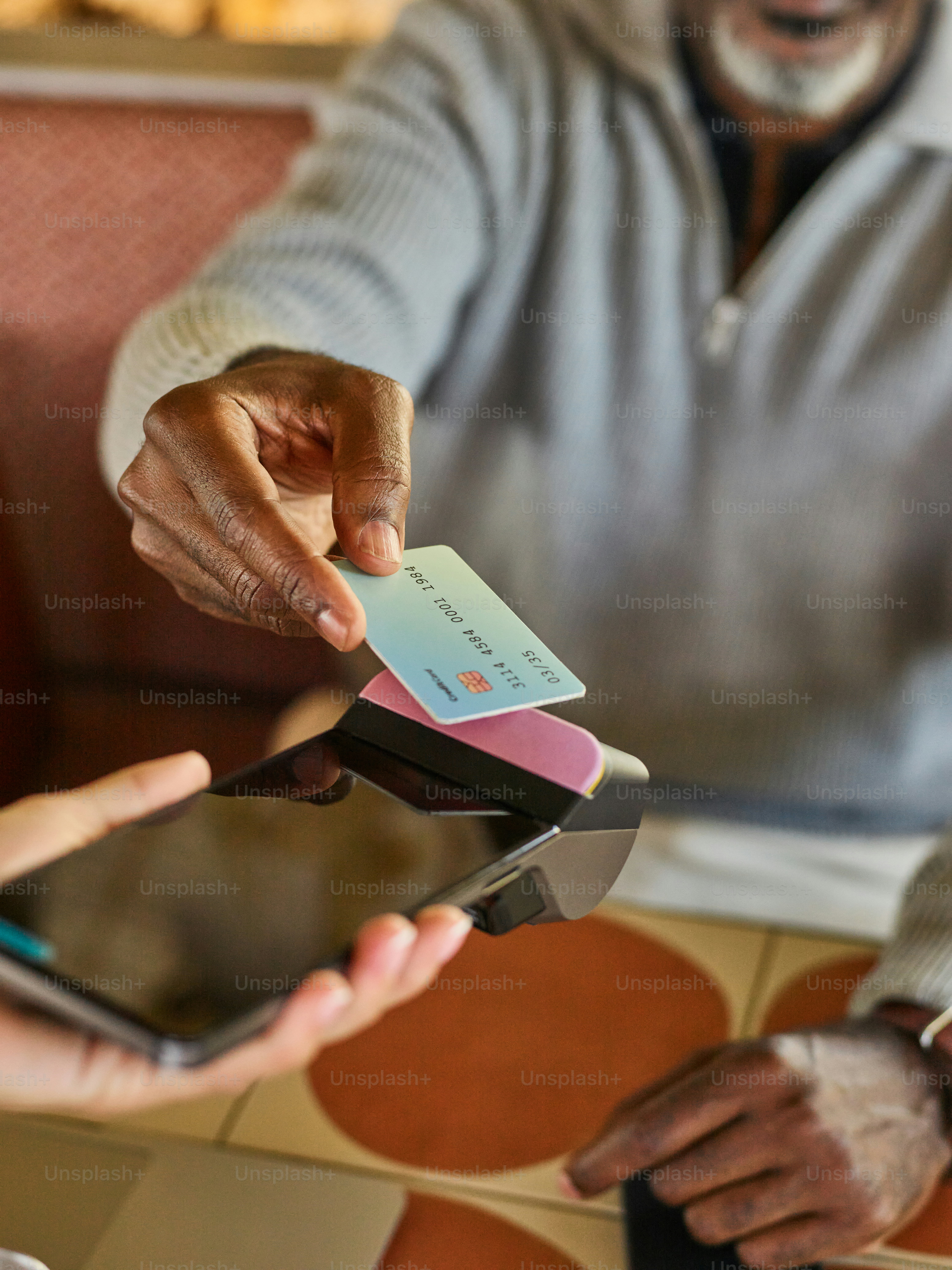Customer taps credit card on payment terminal