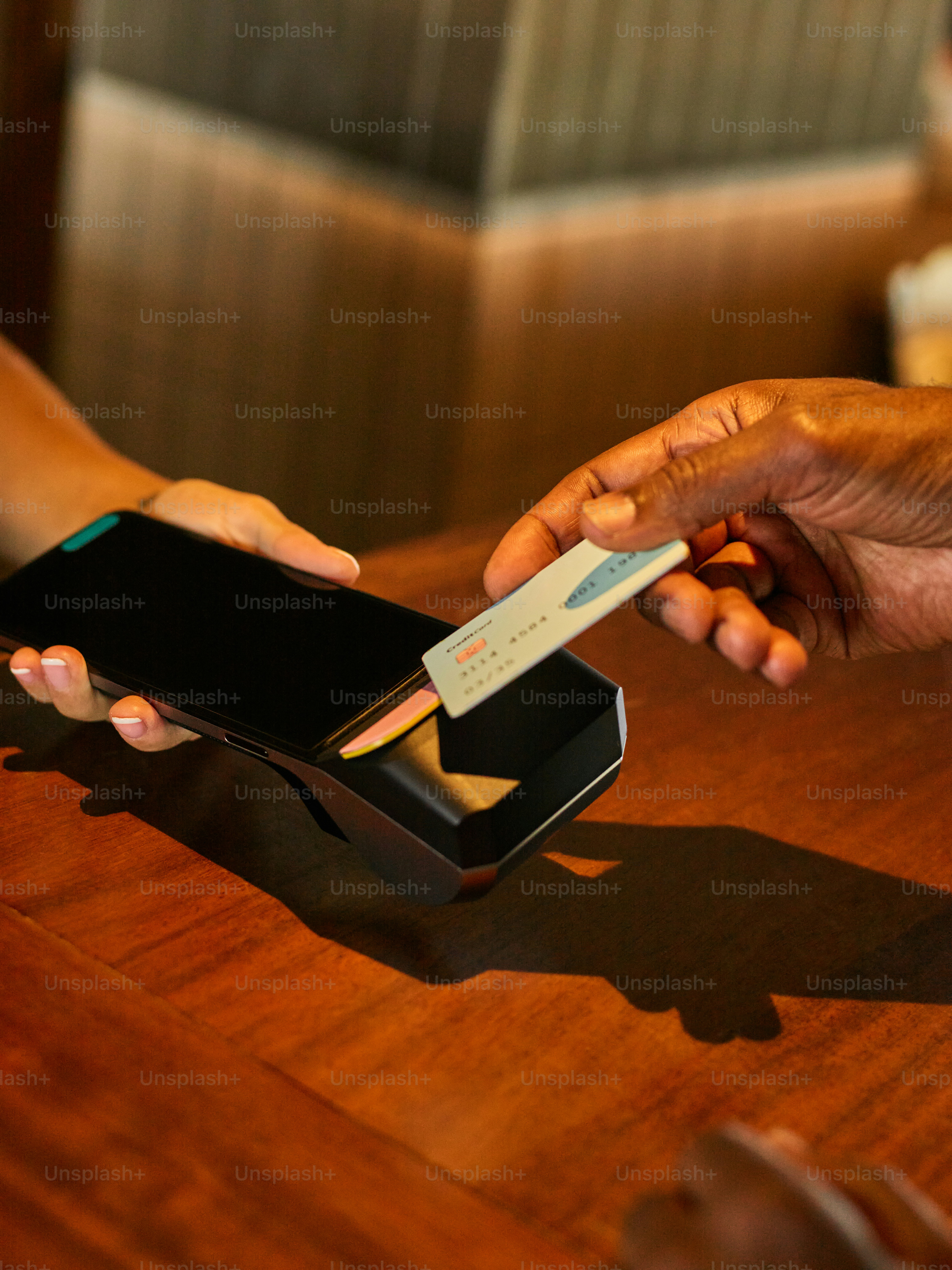 Customer paying with credit card at point of sale.