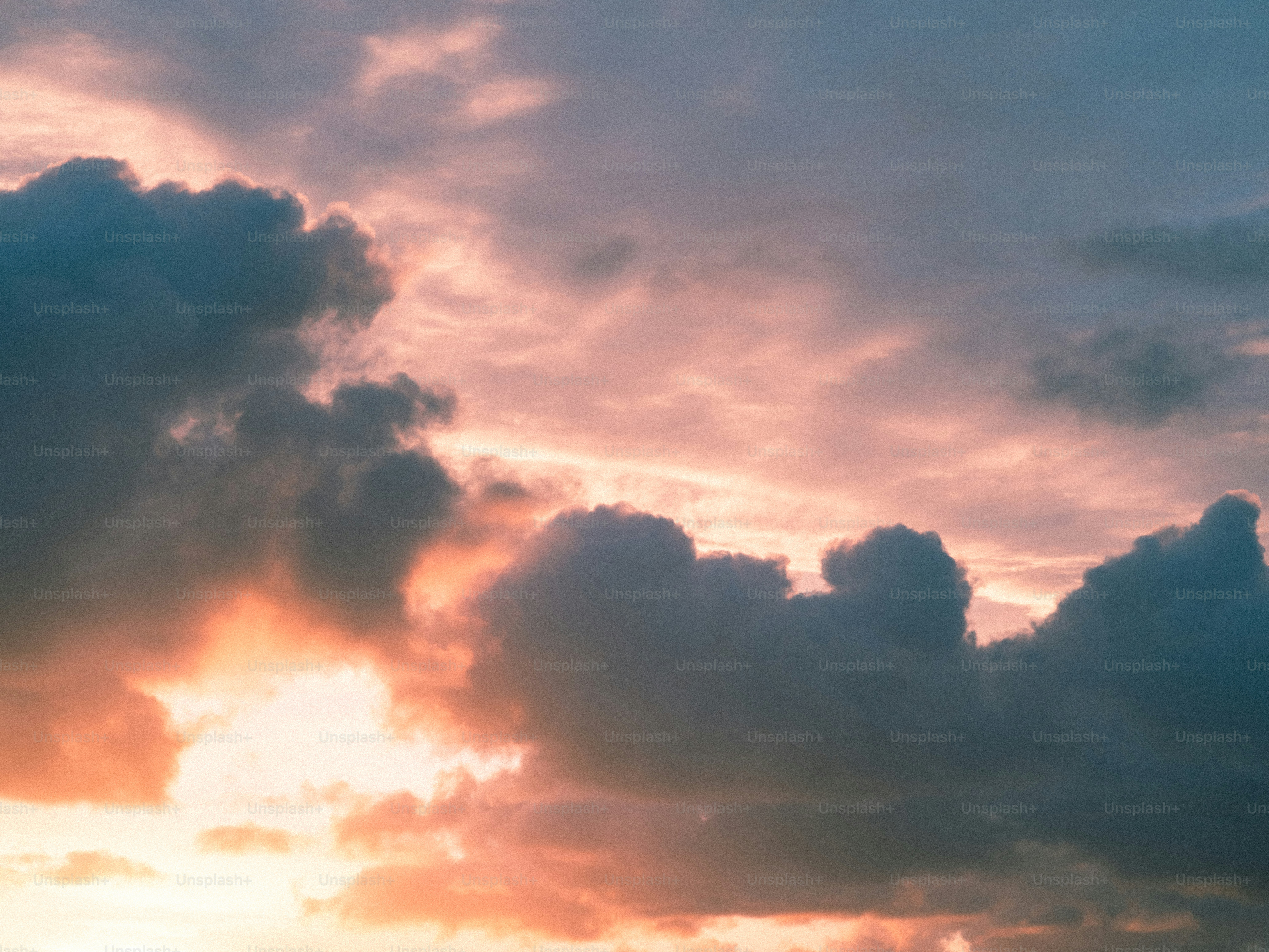 Dramatic sunset clouds with orange and blue hues