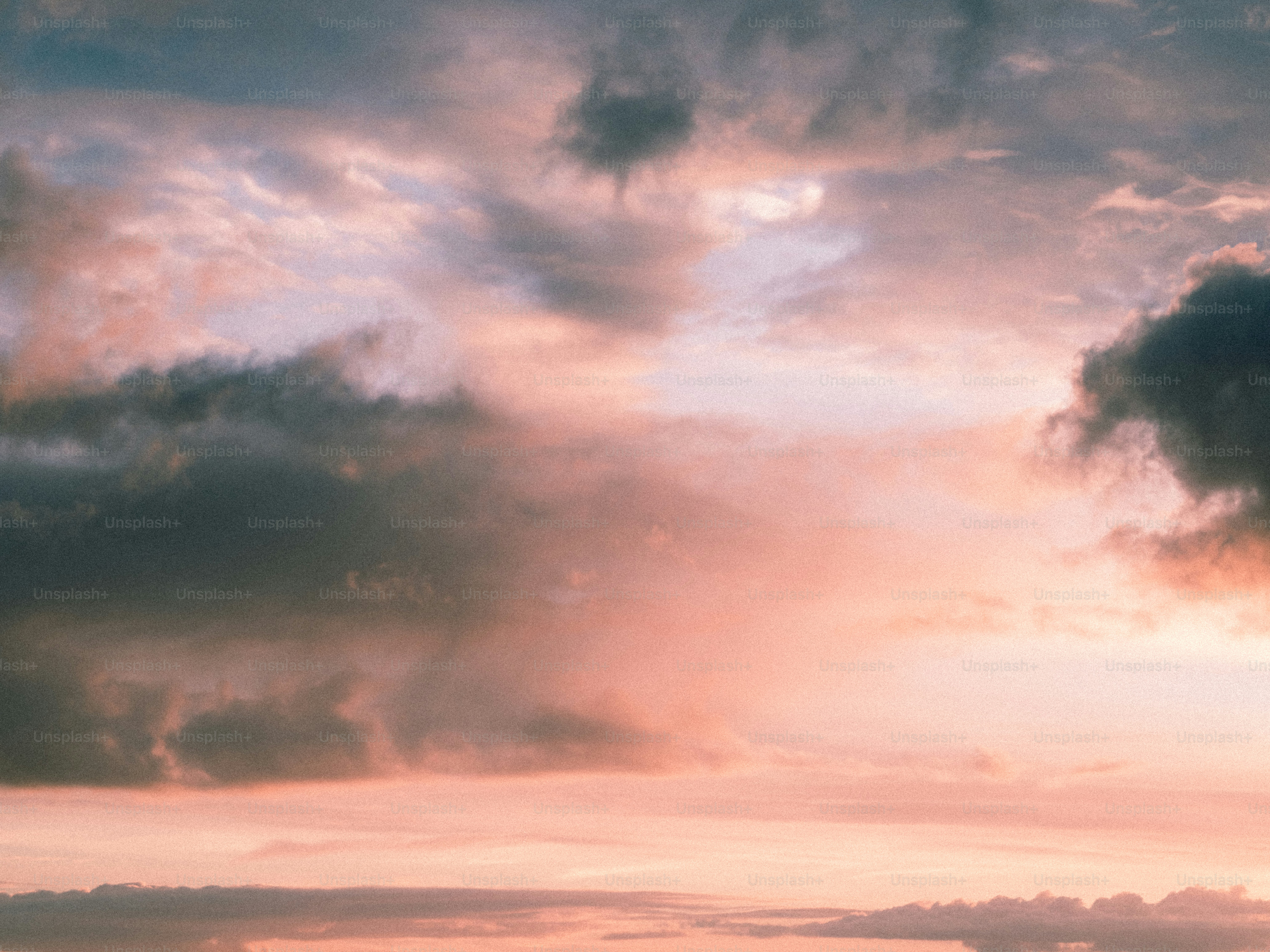 Pink and gray clouds at sunset