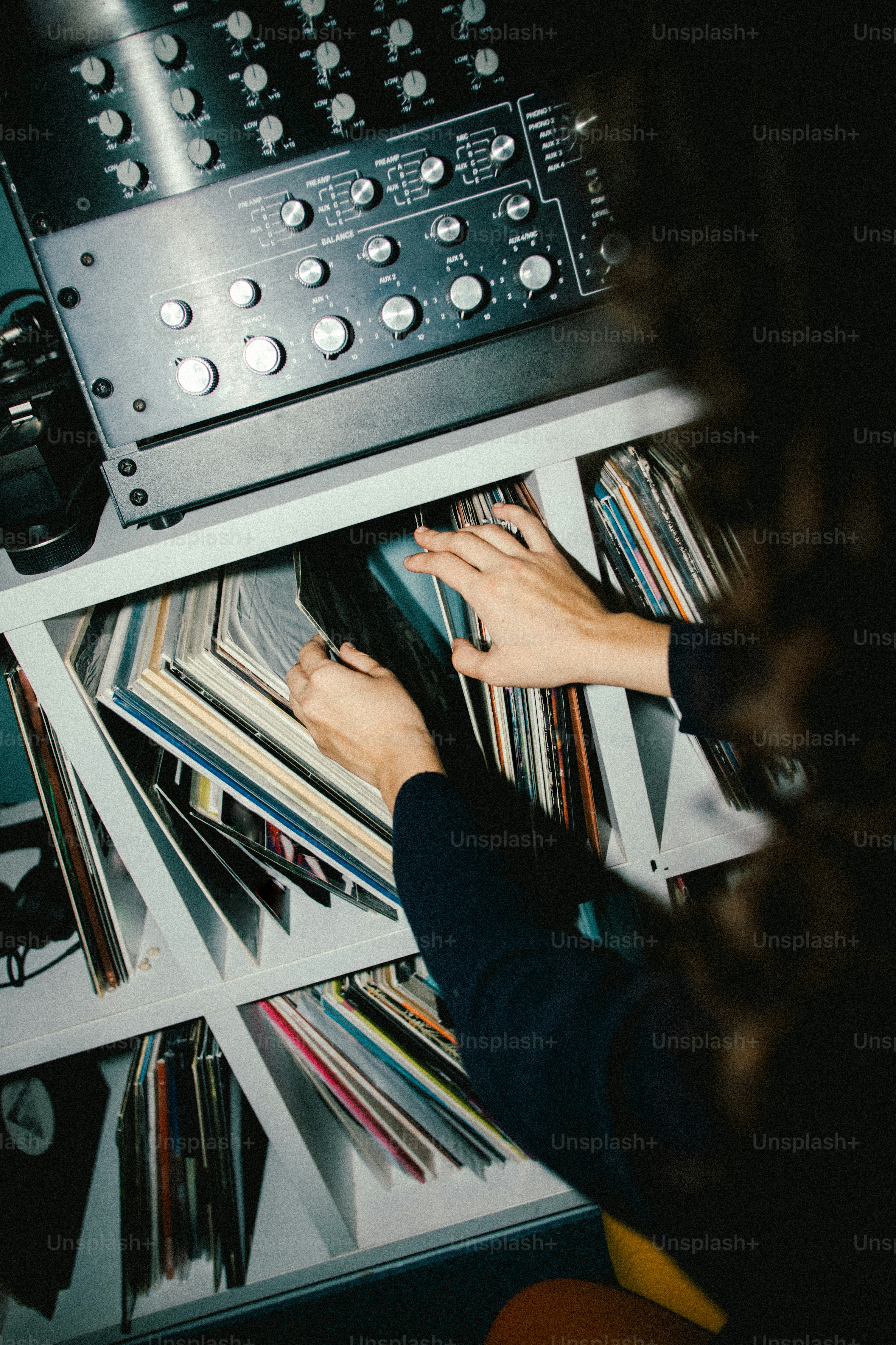 Hands sorting through a record collection photo – Music Image on Unsplash