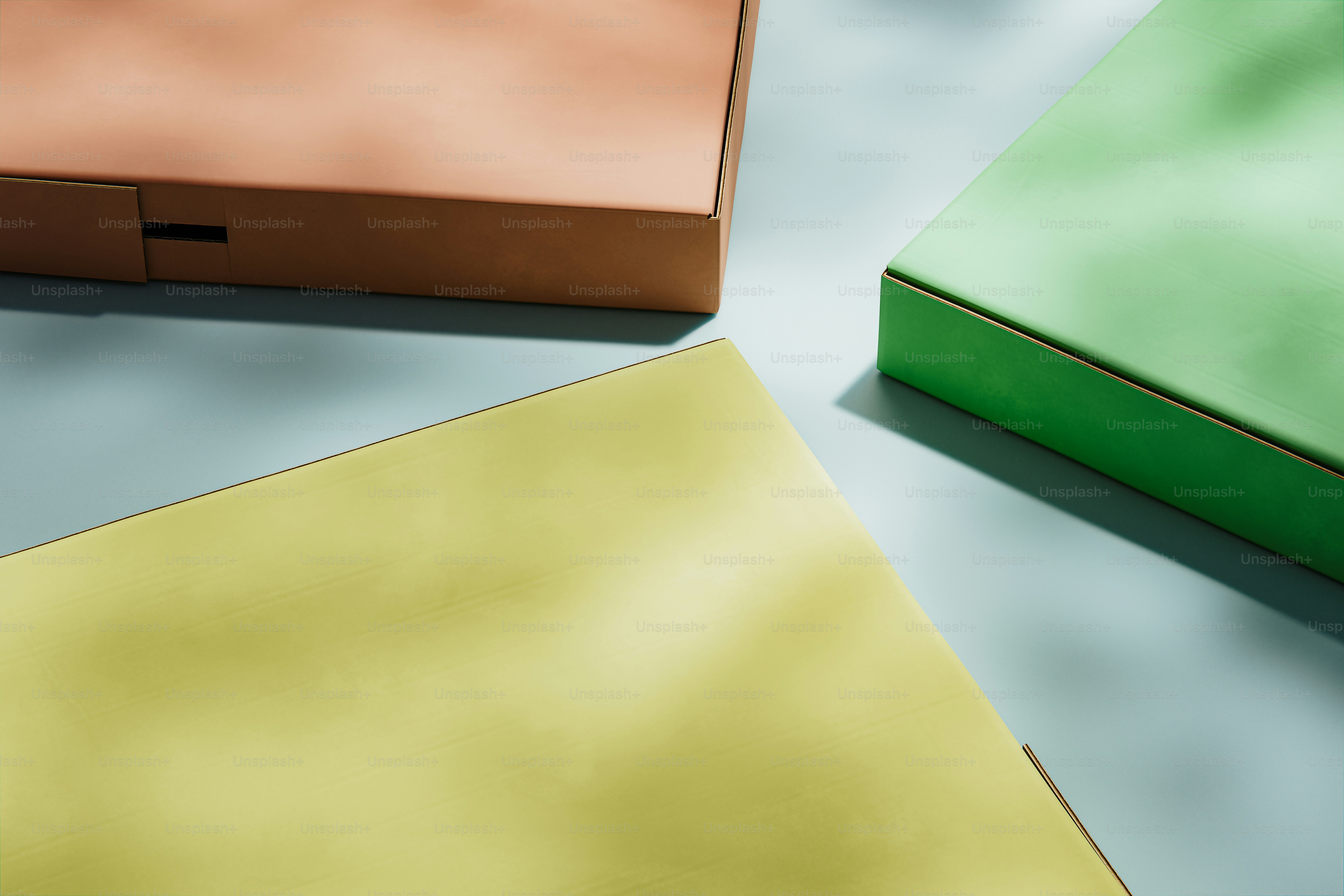 Three colorful boxes on a light blue surface. photo – Logistics Image ...