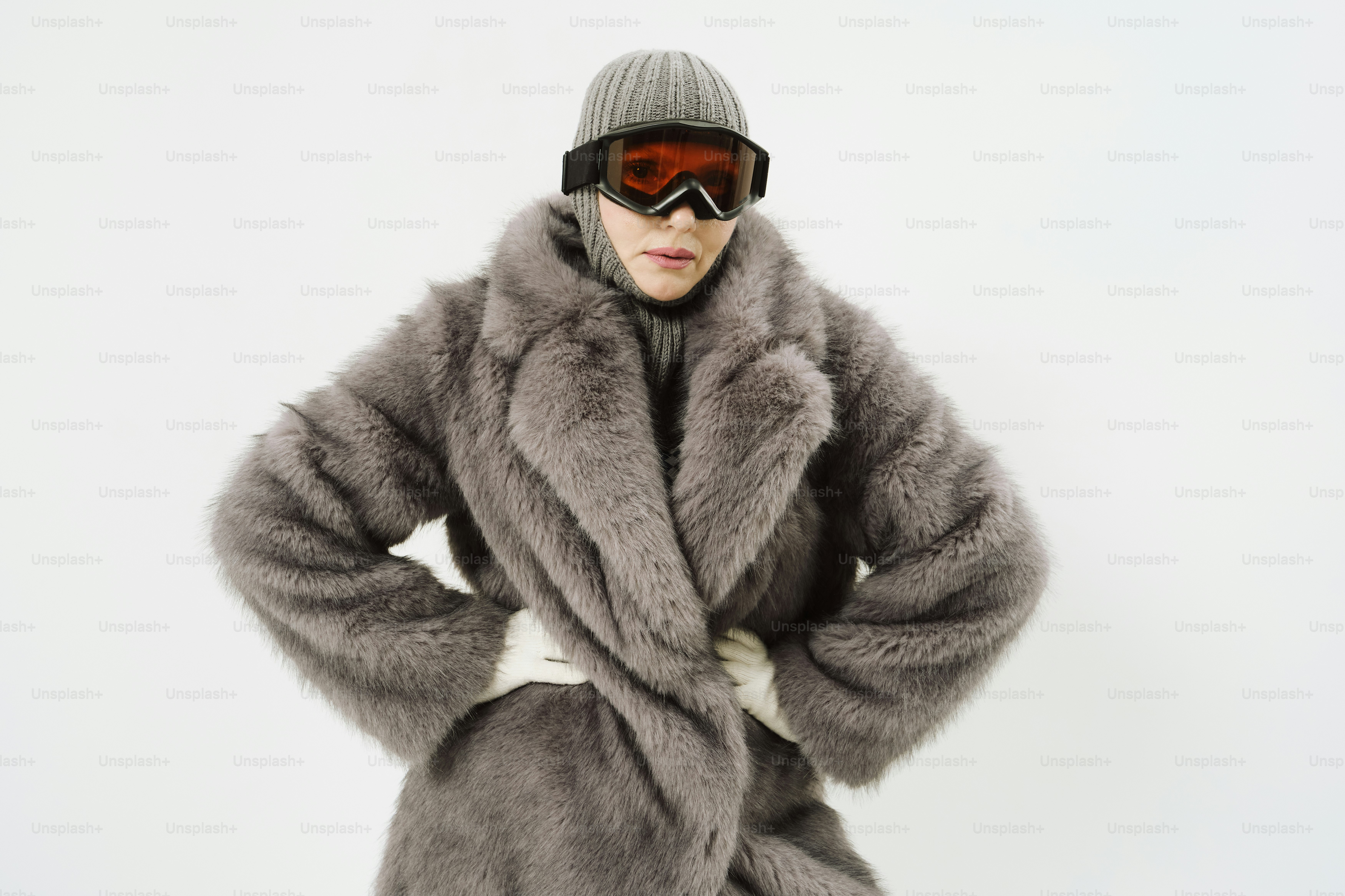 Woman in fur coat and ski goggles