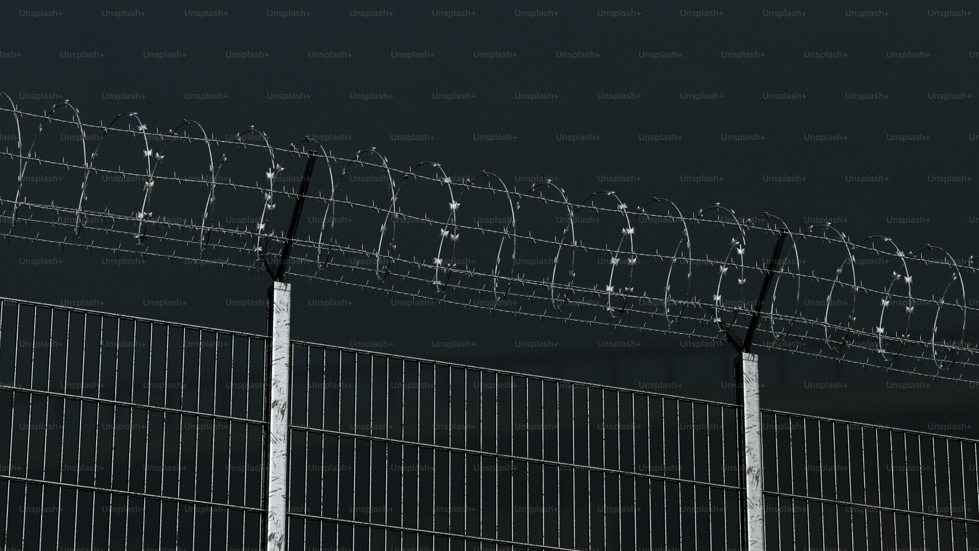 Barbed wire fence against a dark sky photo – 3d render Image on Unsplash