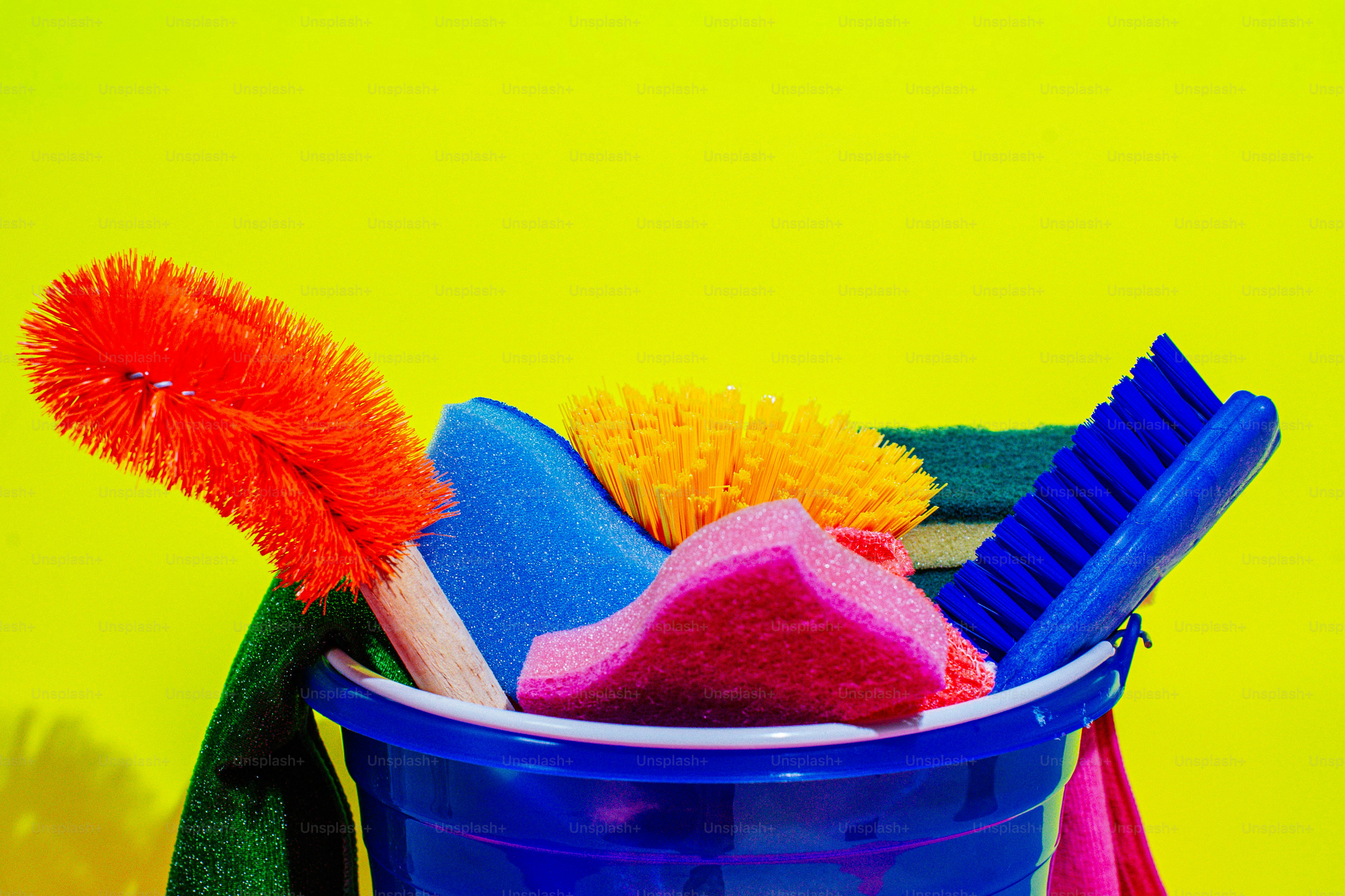 A blue bucket filled with cleaning supplies photo – Cleaning Image on ...