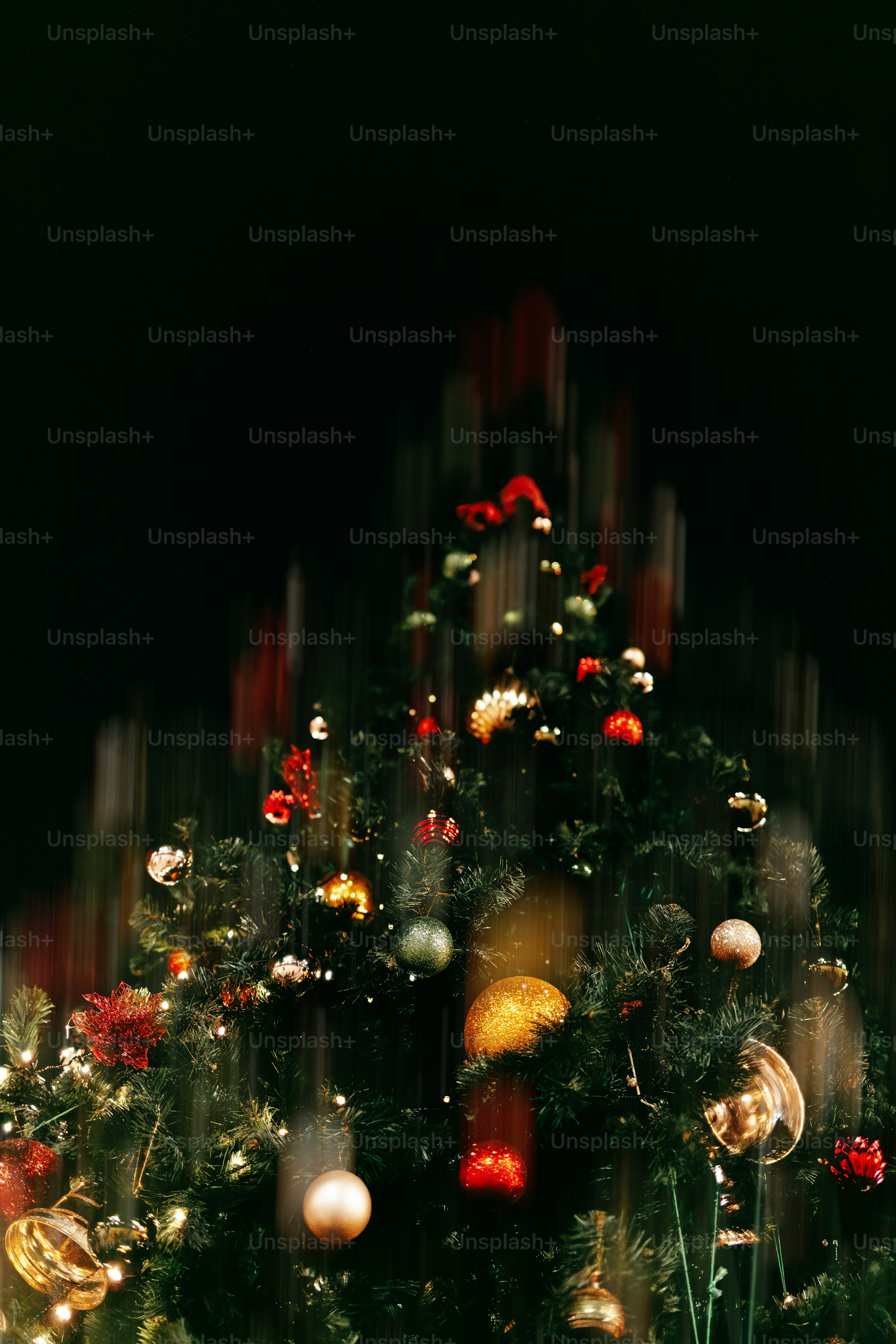 Decorated christmas tree with blurred lights at night