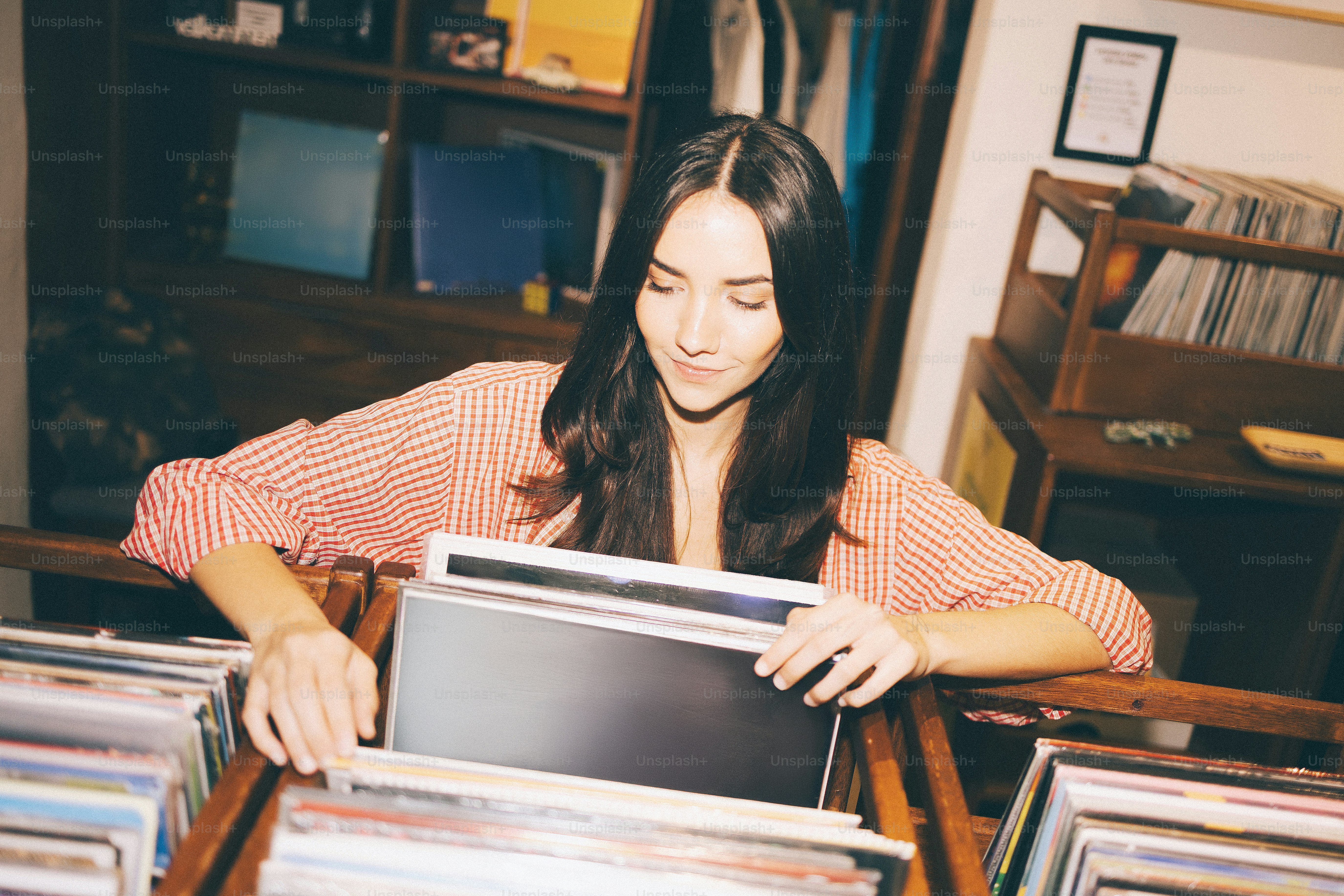 Woman browsing records in a store