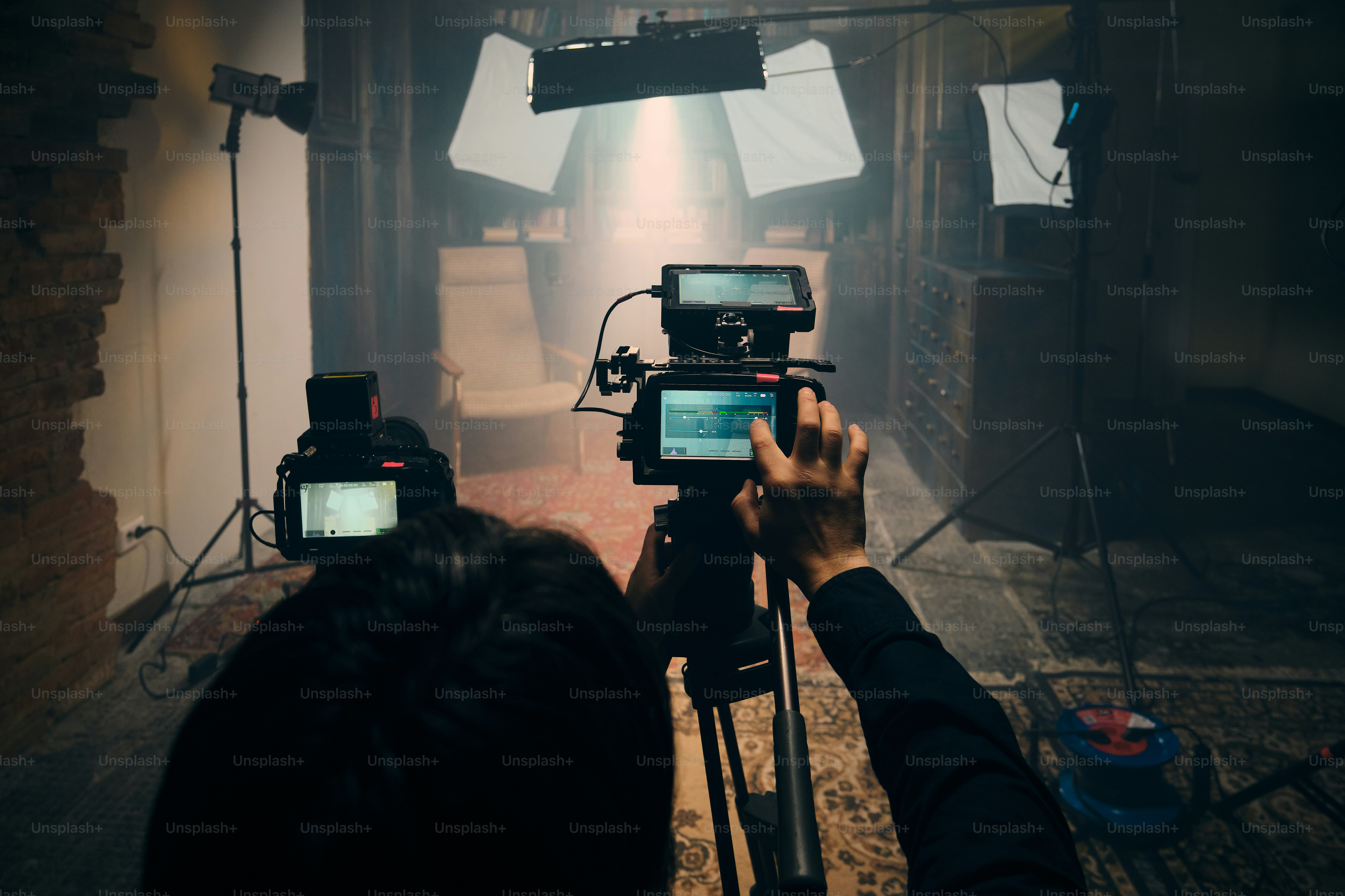 Filming a scene with cameras and lighting equipment. photo – Cinematic ...
