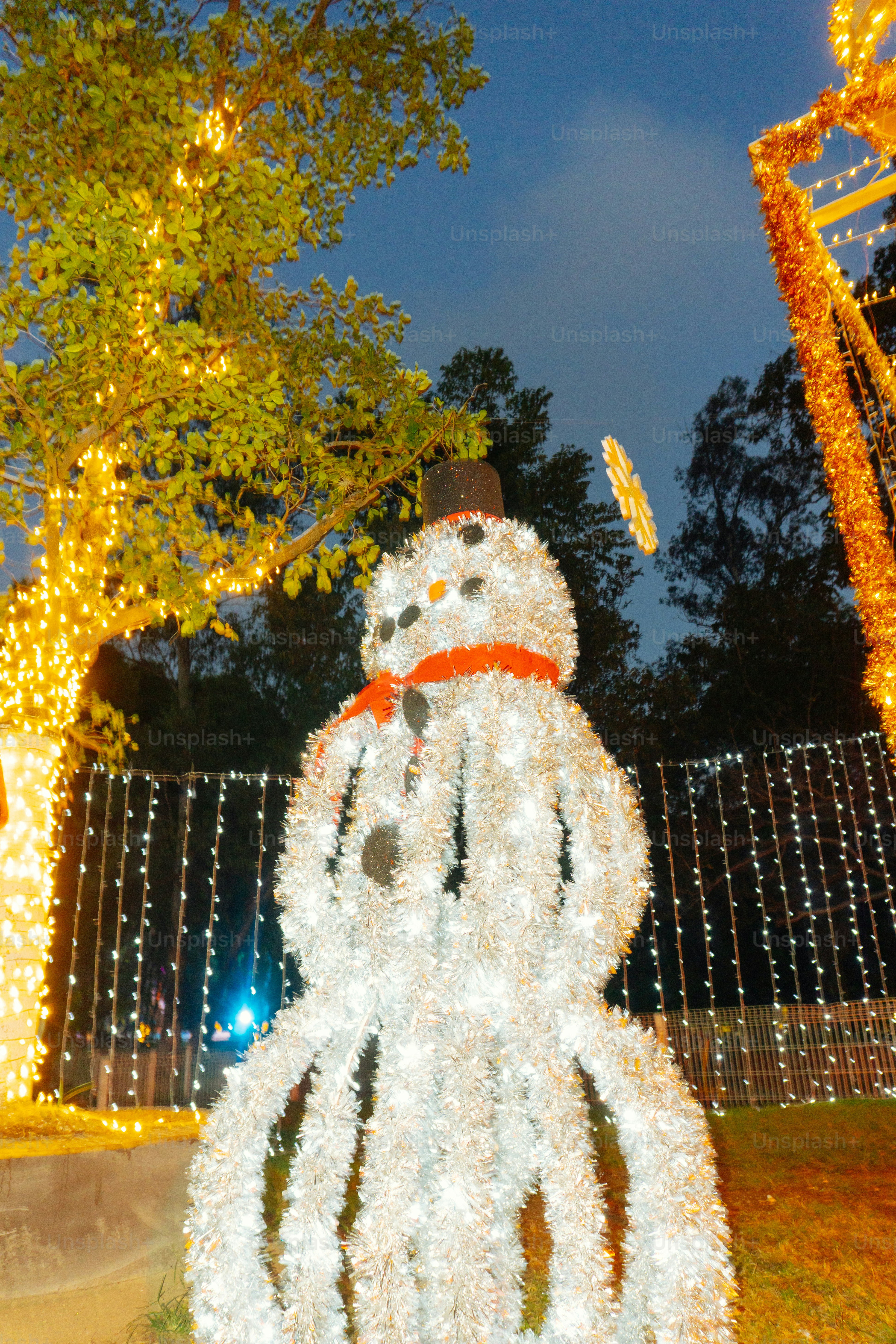A festive snowman decoration with christmas lights