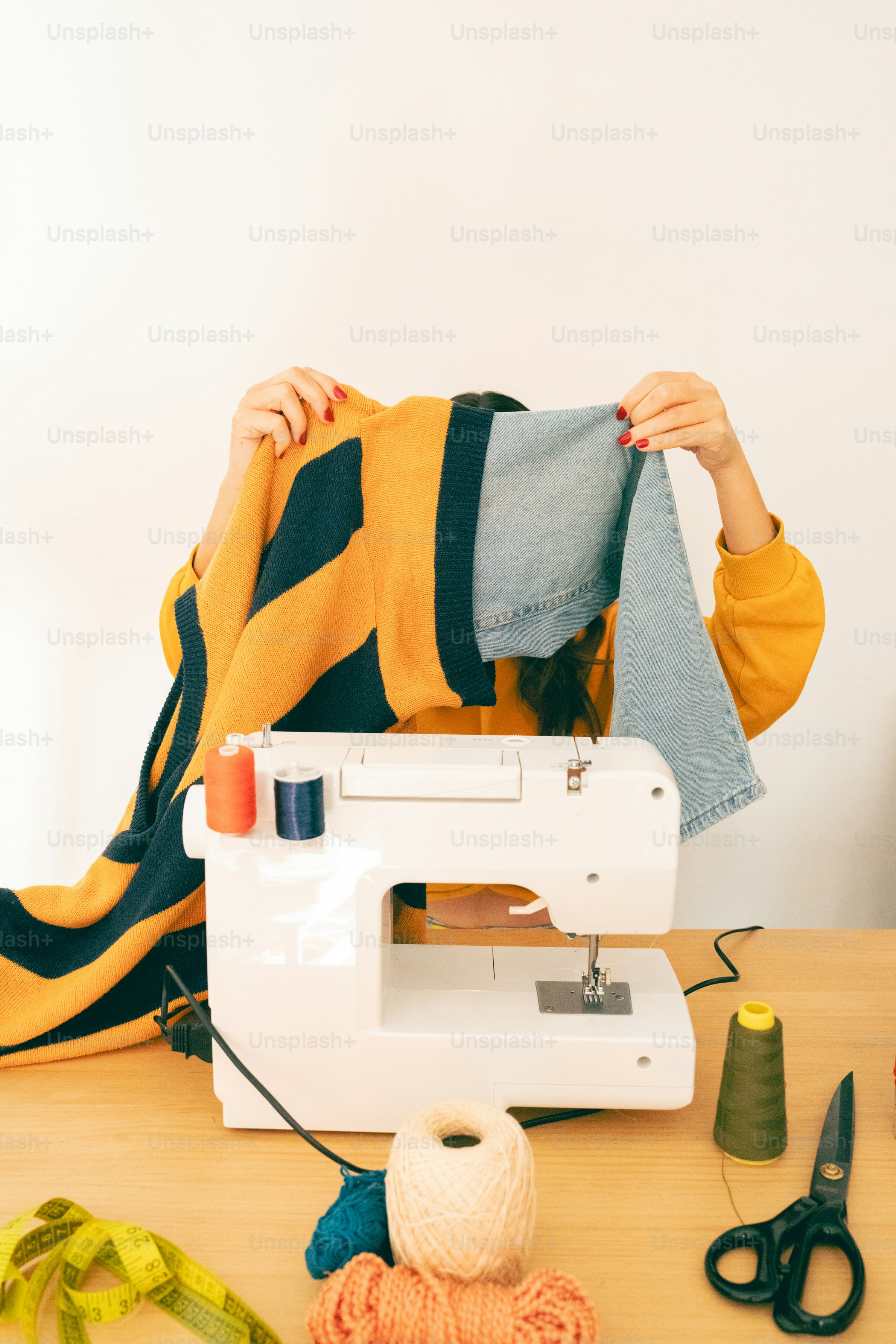Hands sewing fabric with a sewing machine. photo – Sustainability Image ...