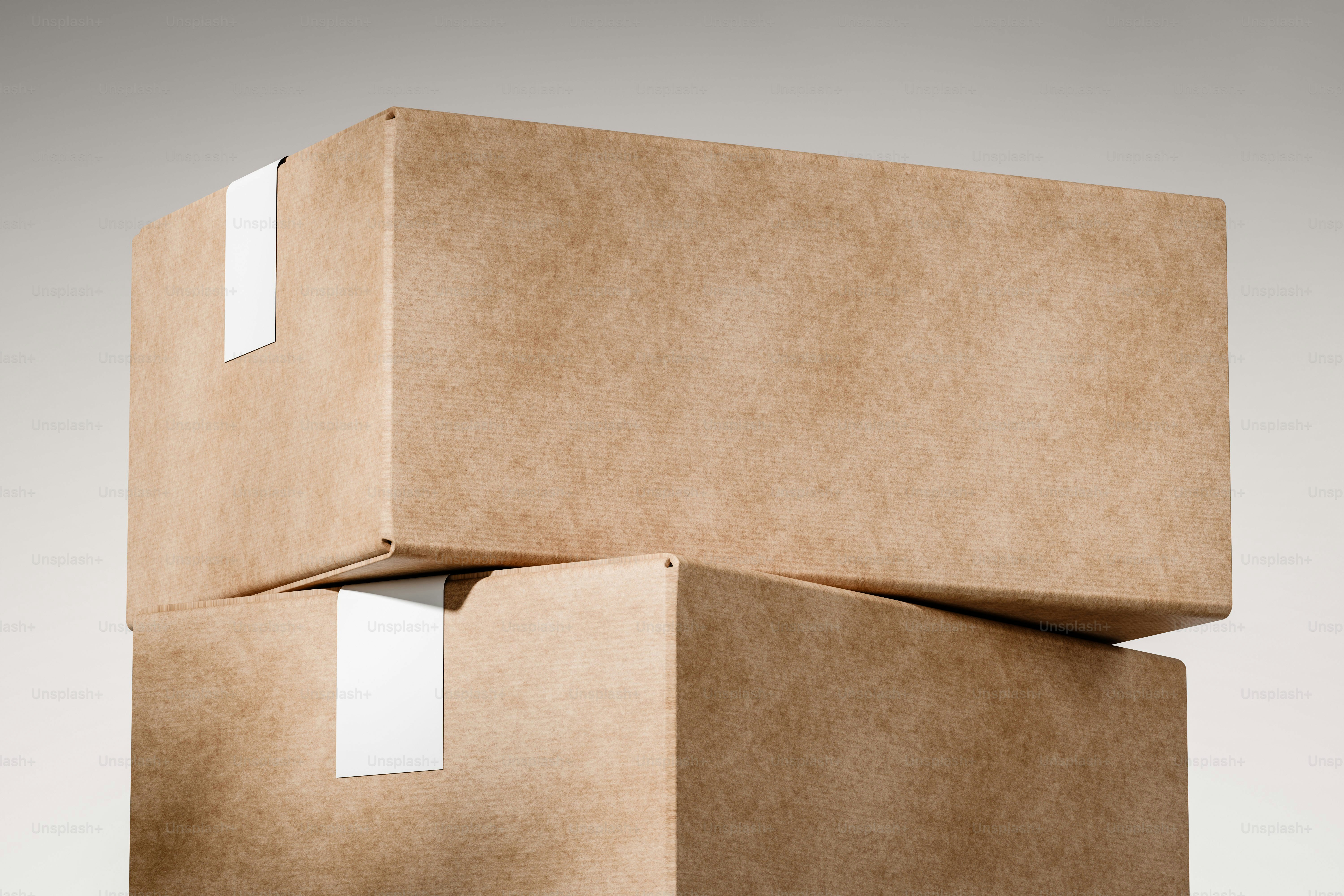 Two cardboard boxes stacked on a plain background.