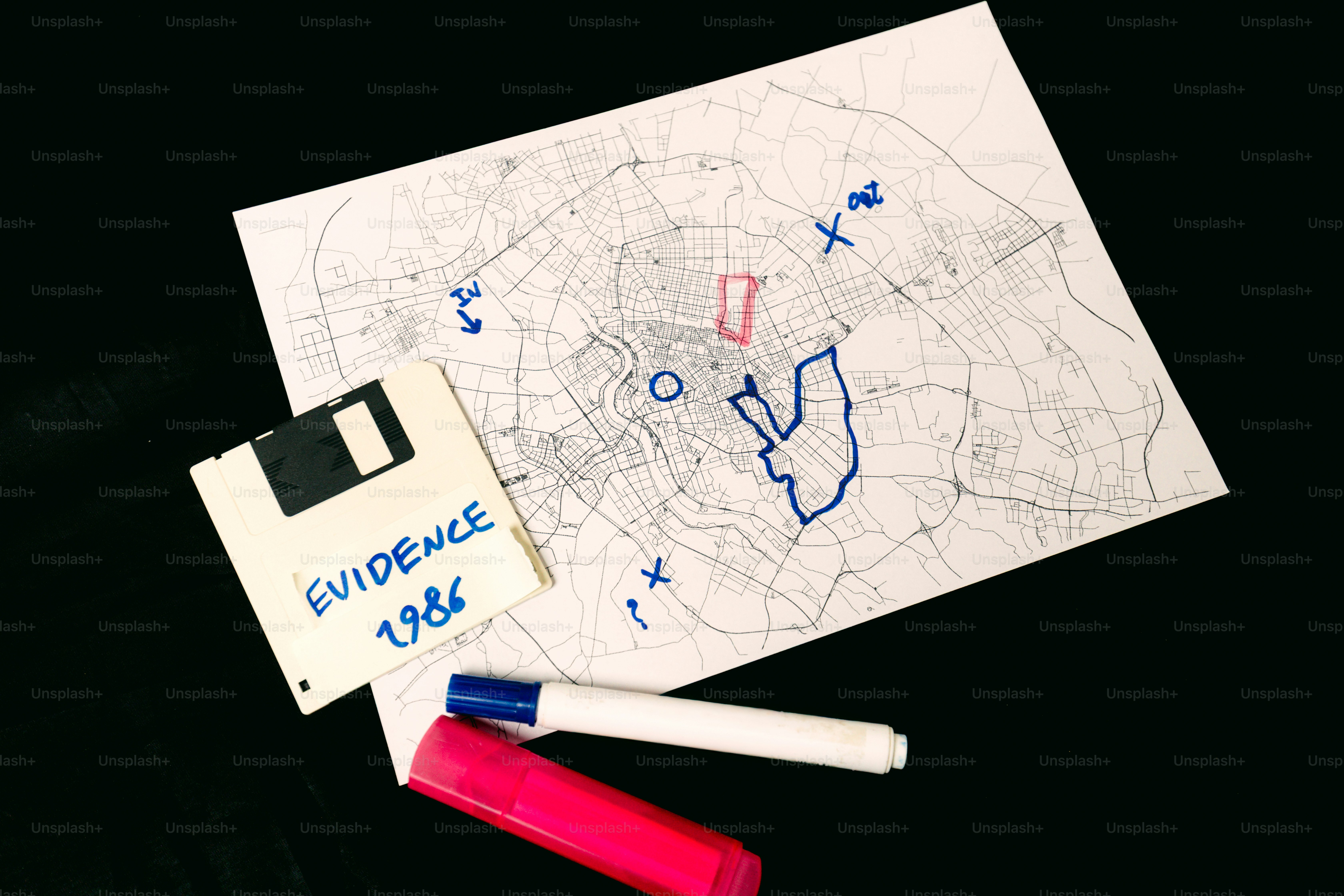 Map with evidence marker and floppy disk