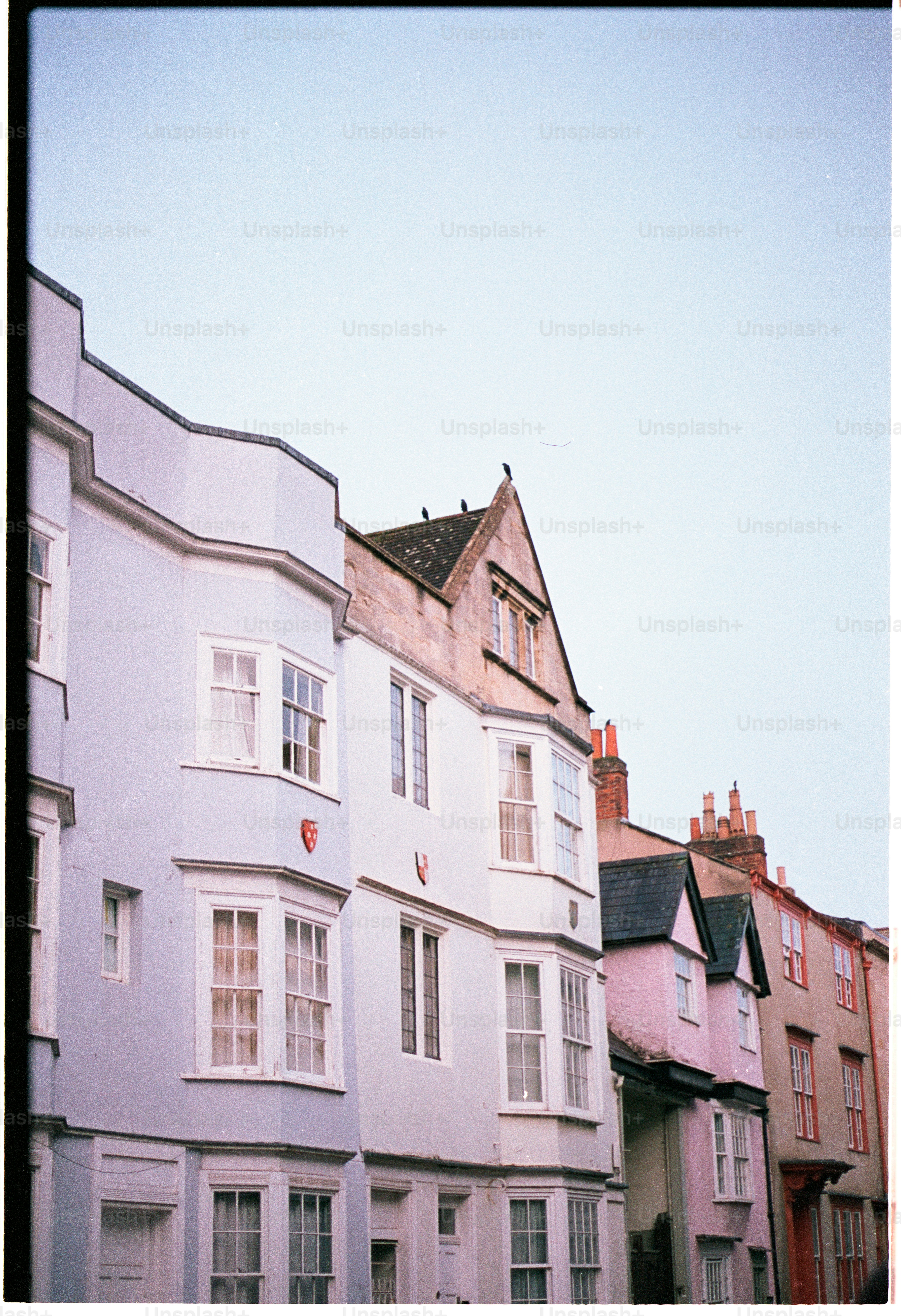 Row of colorful houses against a clear sky