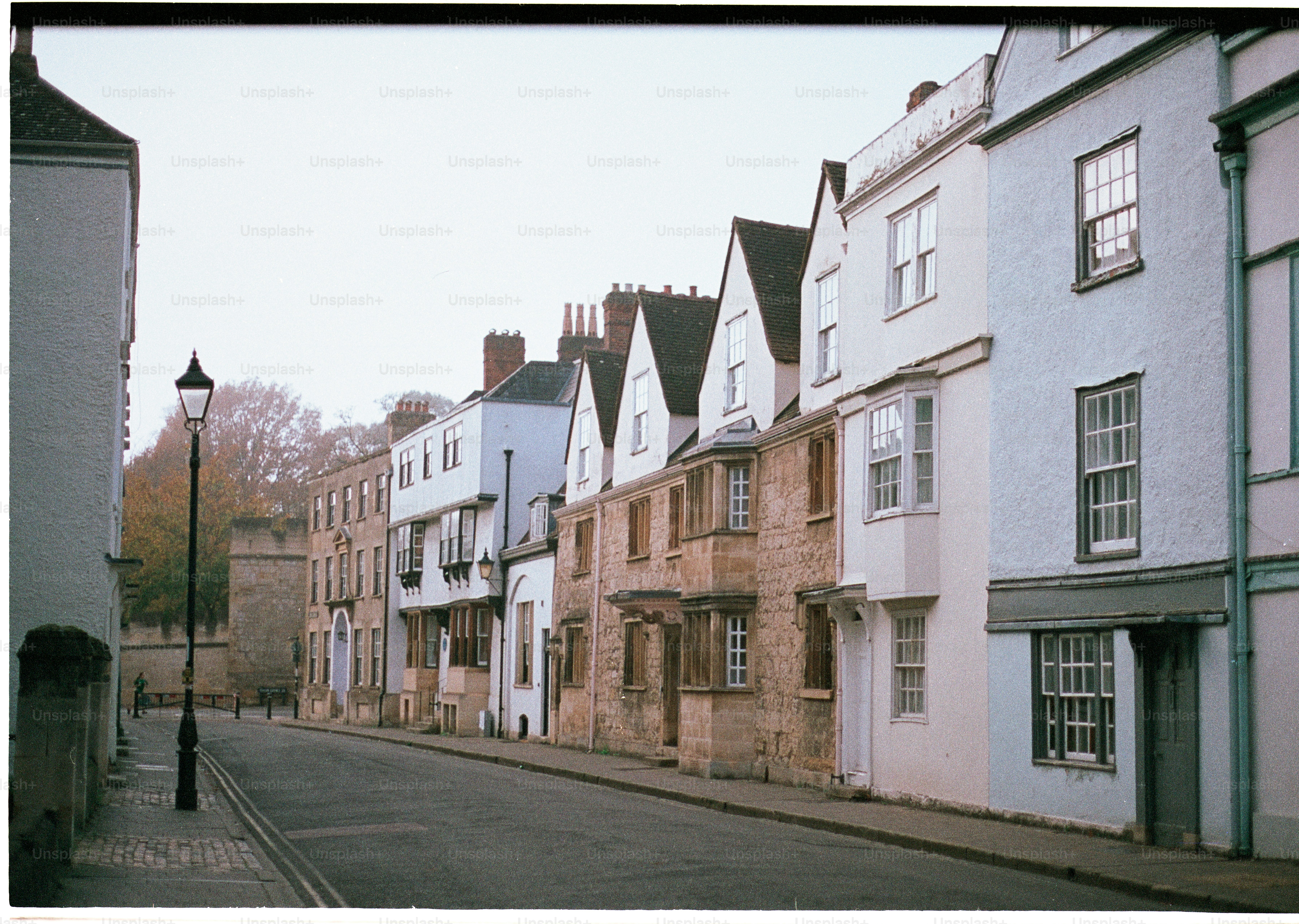 Row of historic buildings along a quiet street.