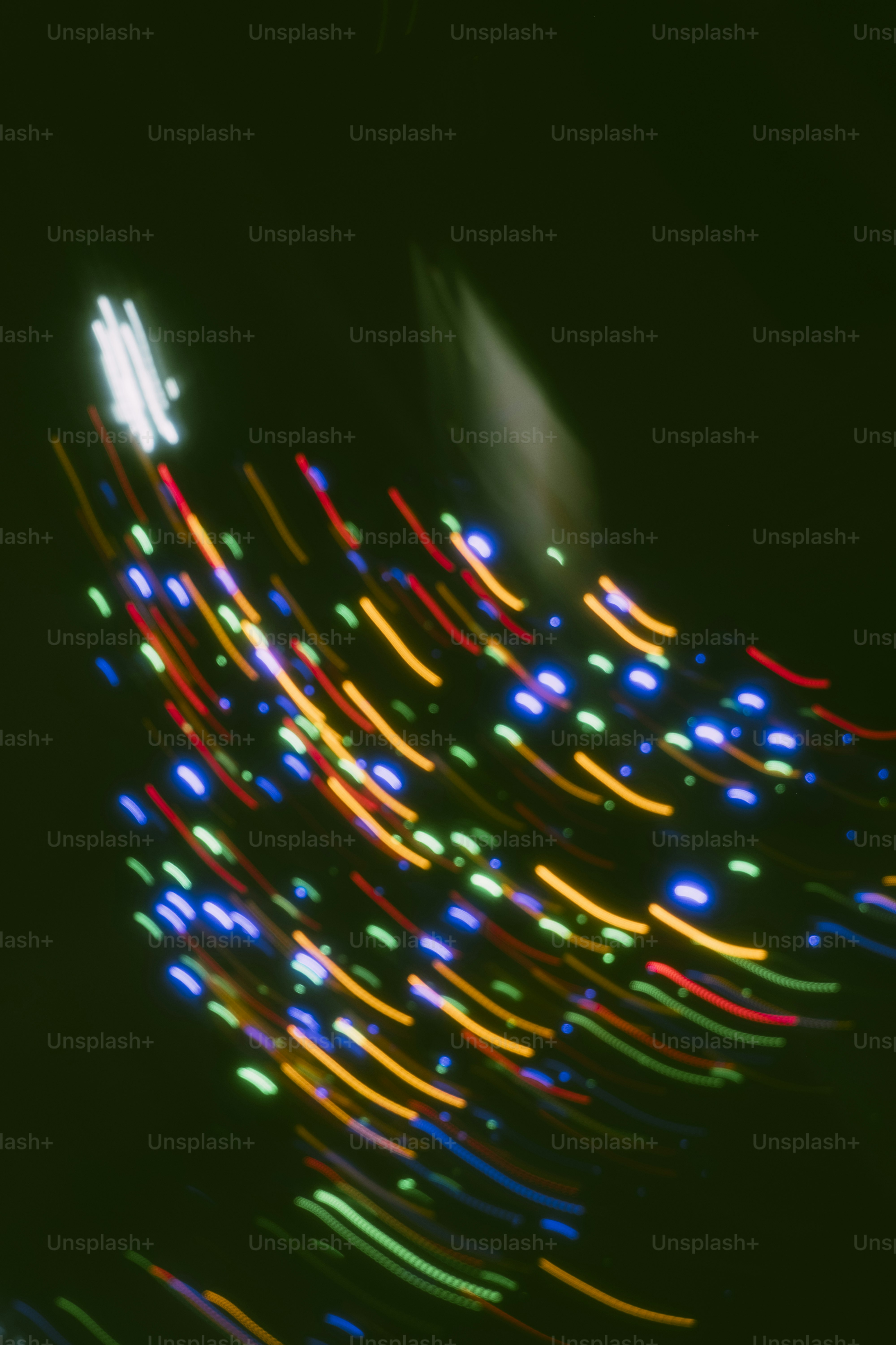 Abstract streaks of colorful lights on dark background photo – Abstract ...