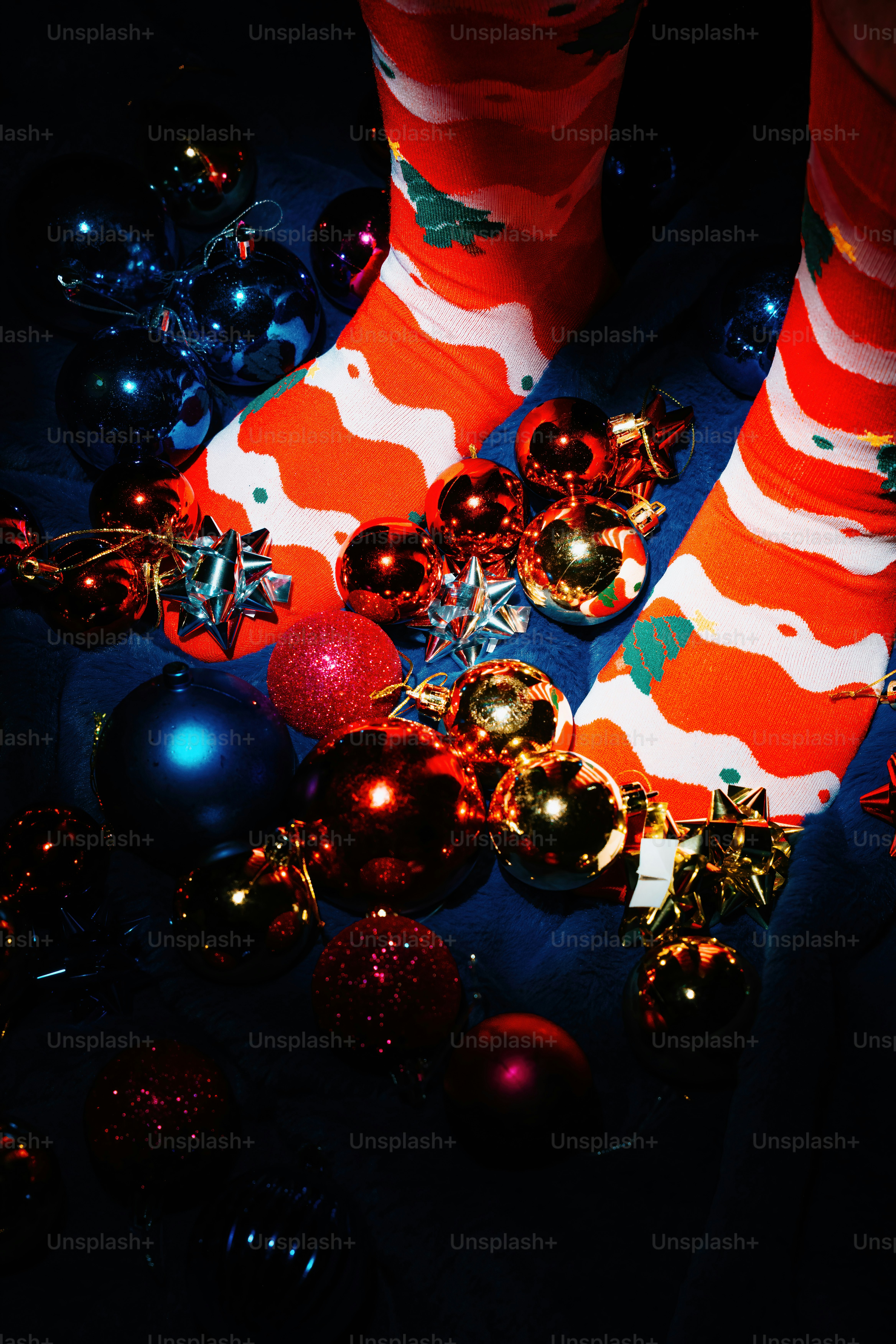 Christmas socks and ornaments on dark background