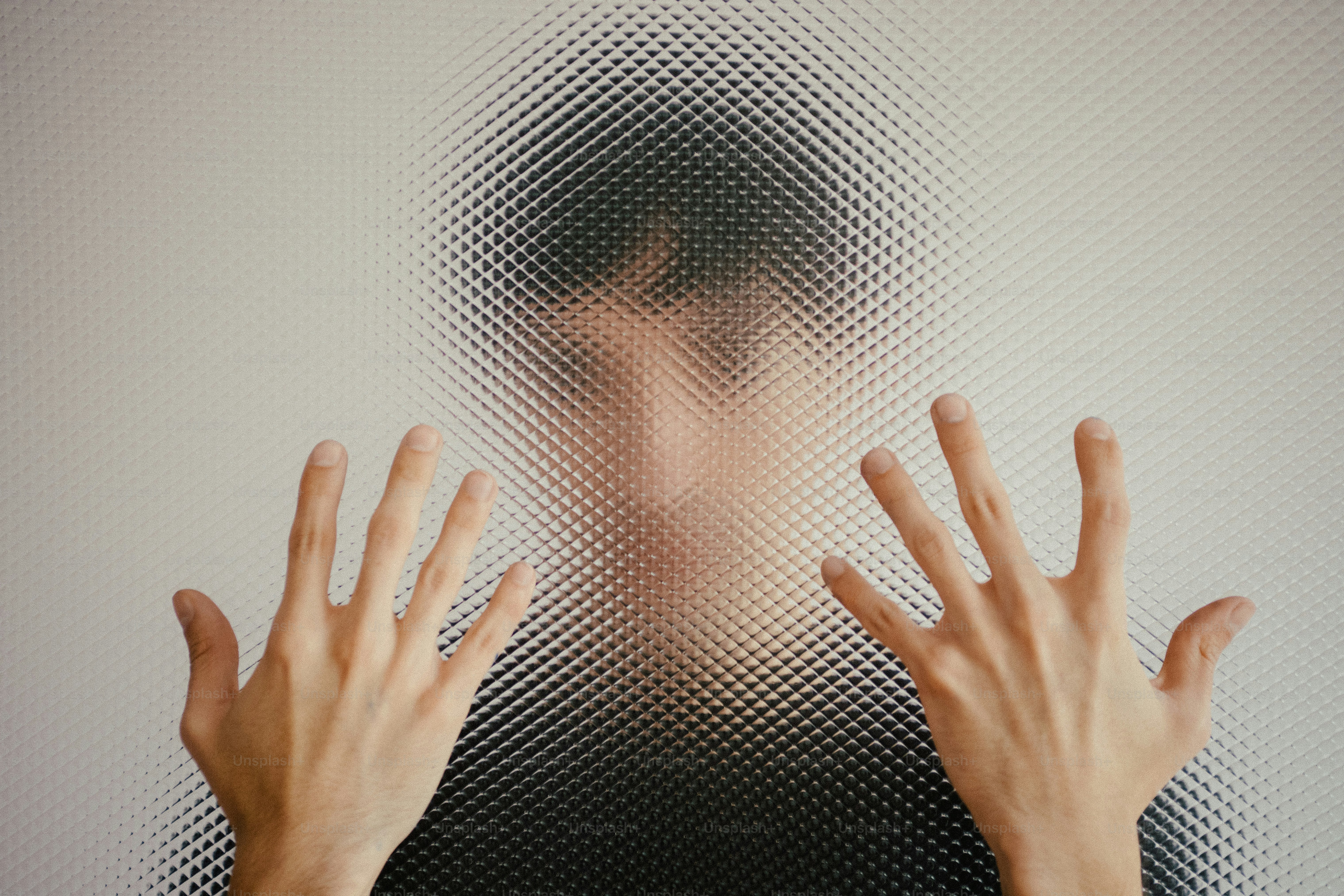 Person's face and hands seen through textured glass photo – Texture ...