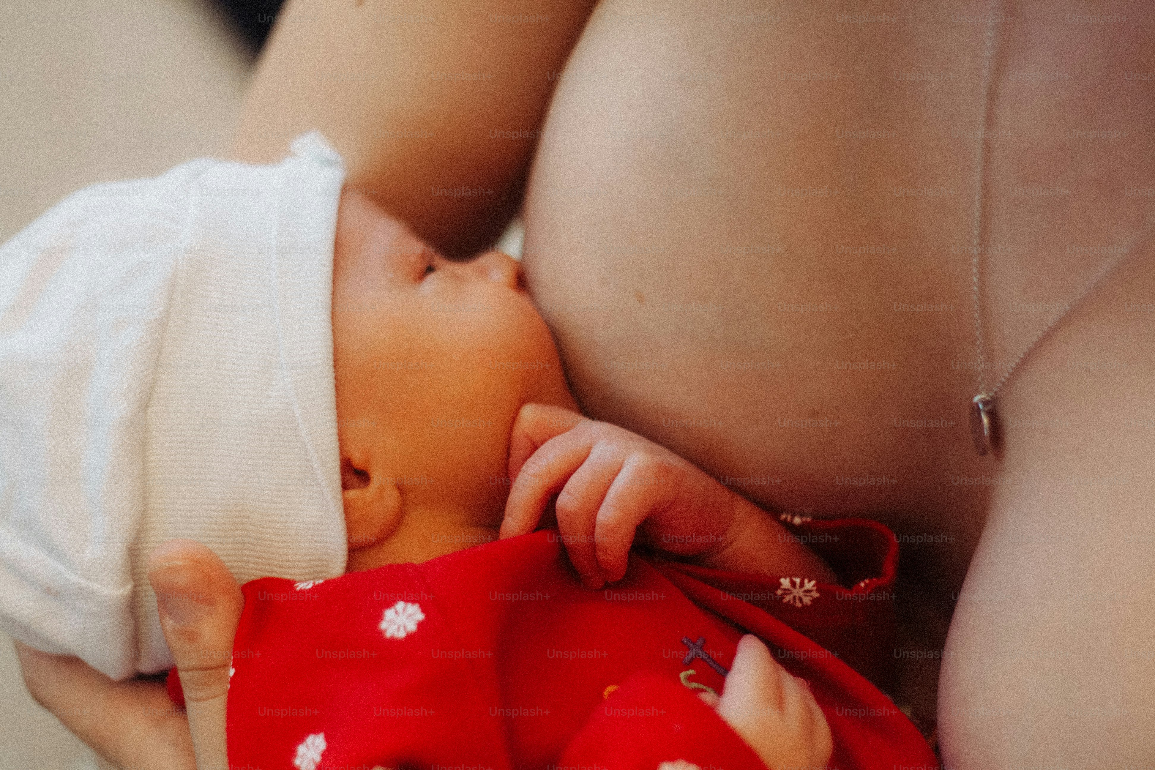 Newborn baby resting on mother's chest