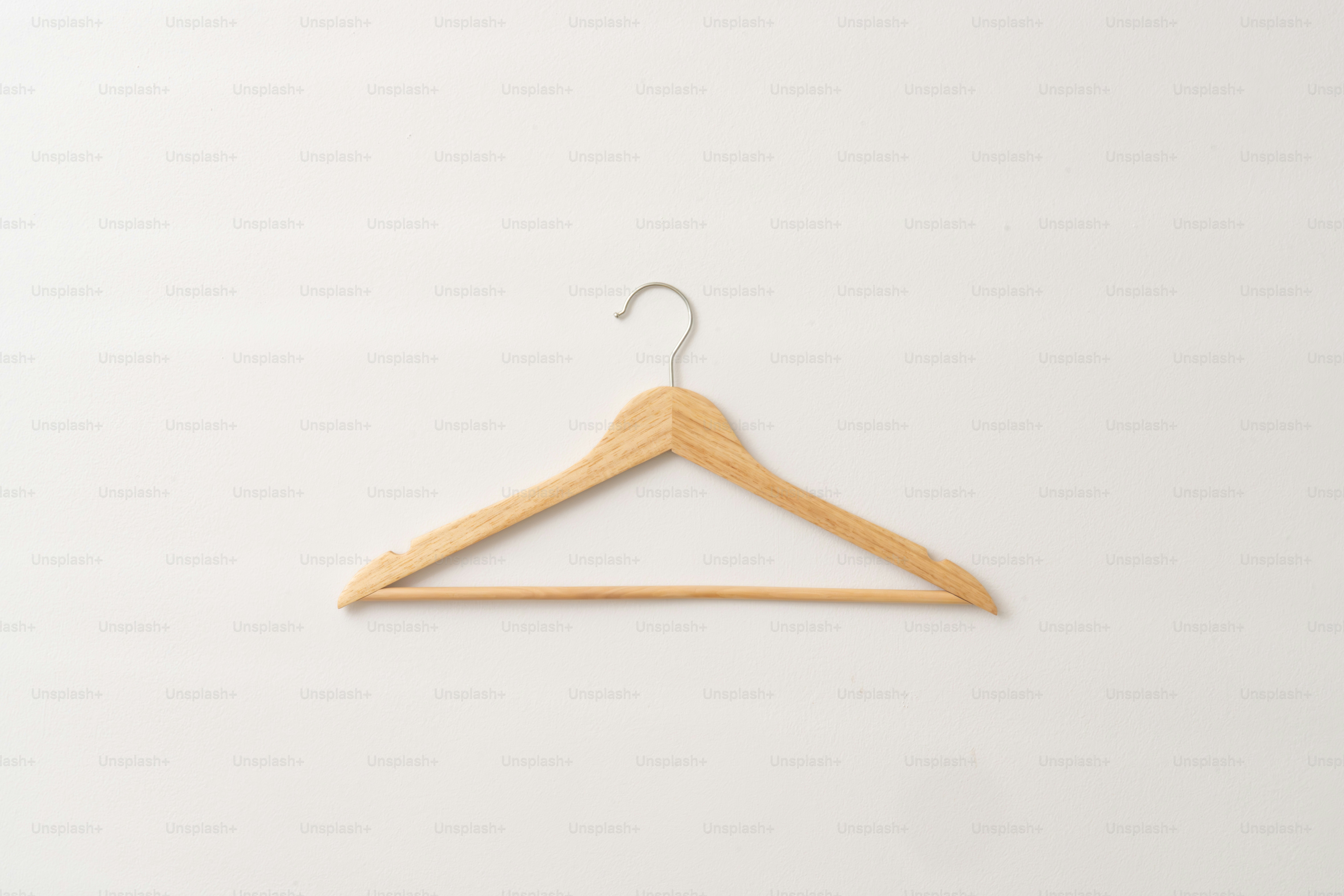 A wooden clothes hanger on a white background