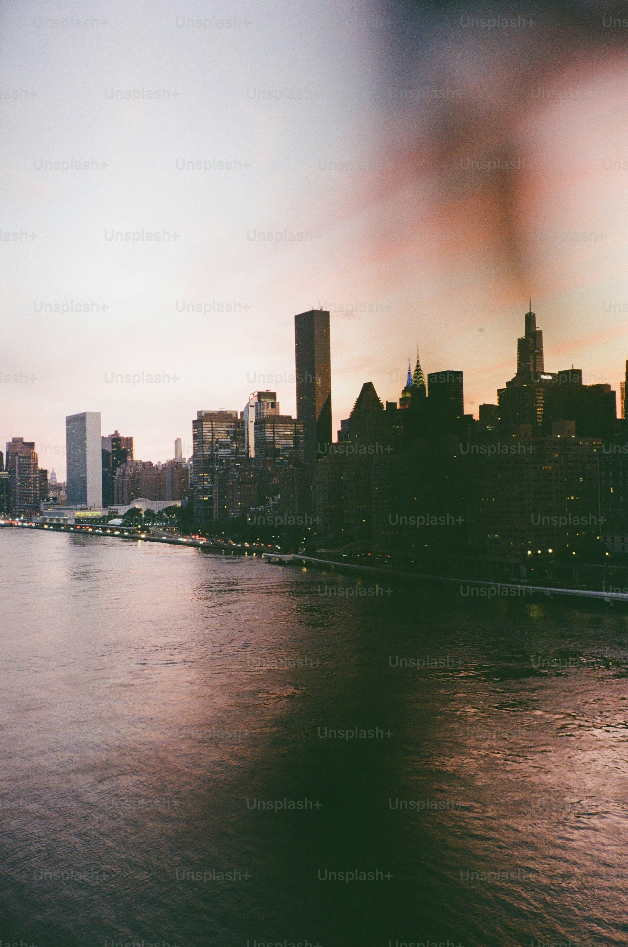 New york city skyline along the east river at dusk.