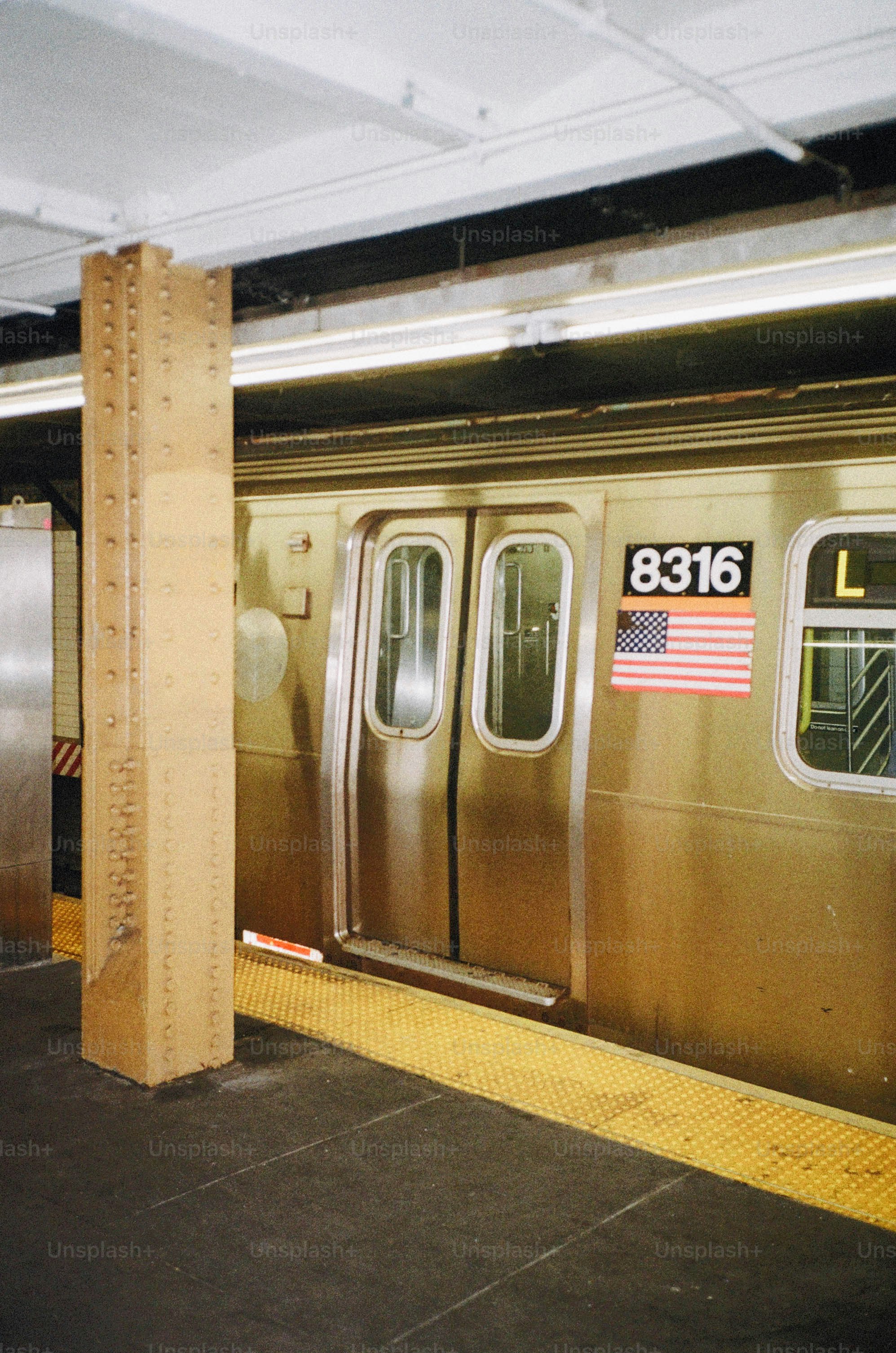 Subway train doors with american flag and number 8316.