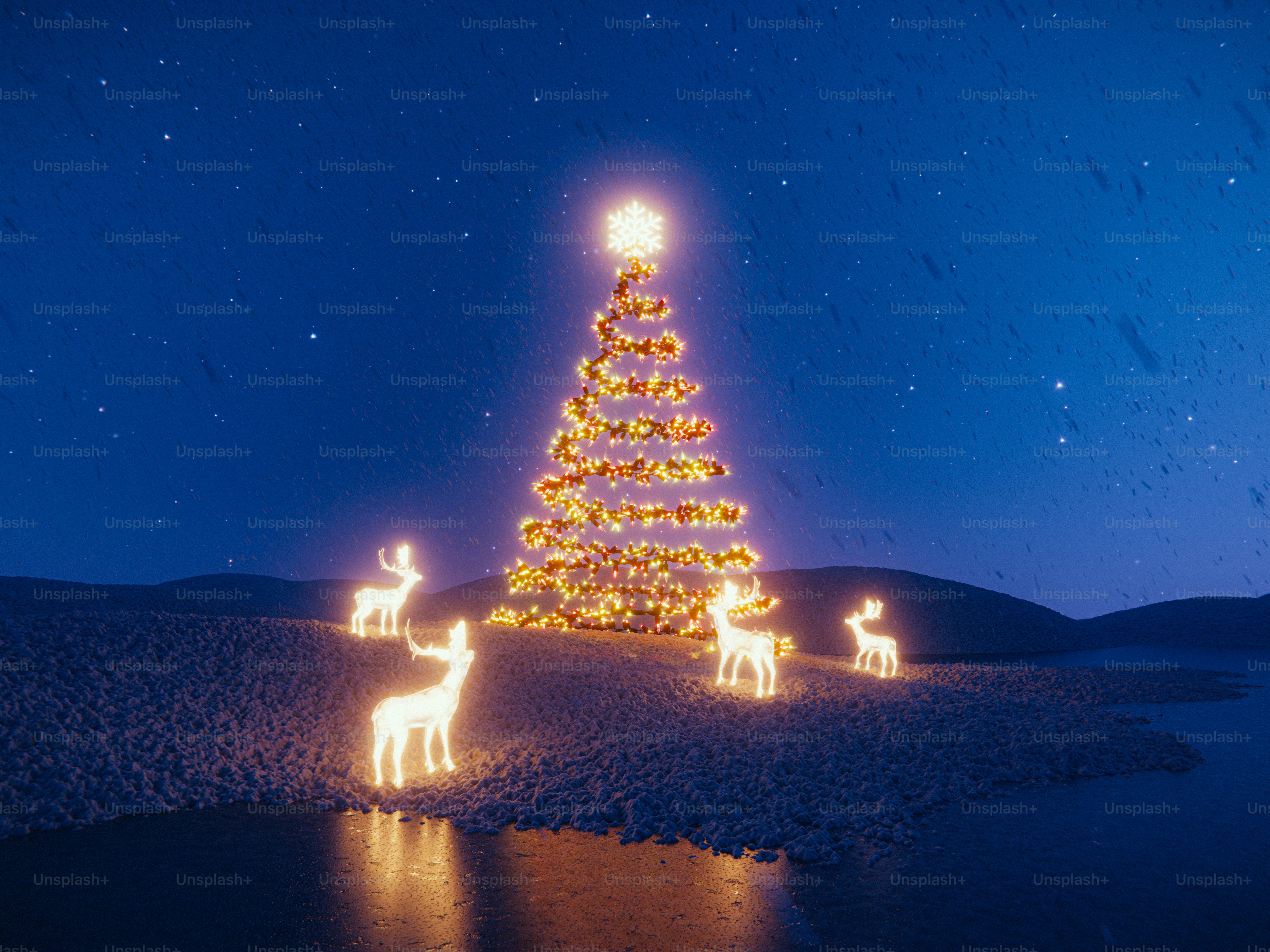Glowing christmas tree and reindeer on snowy landscape