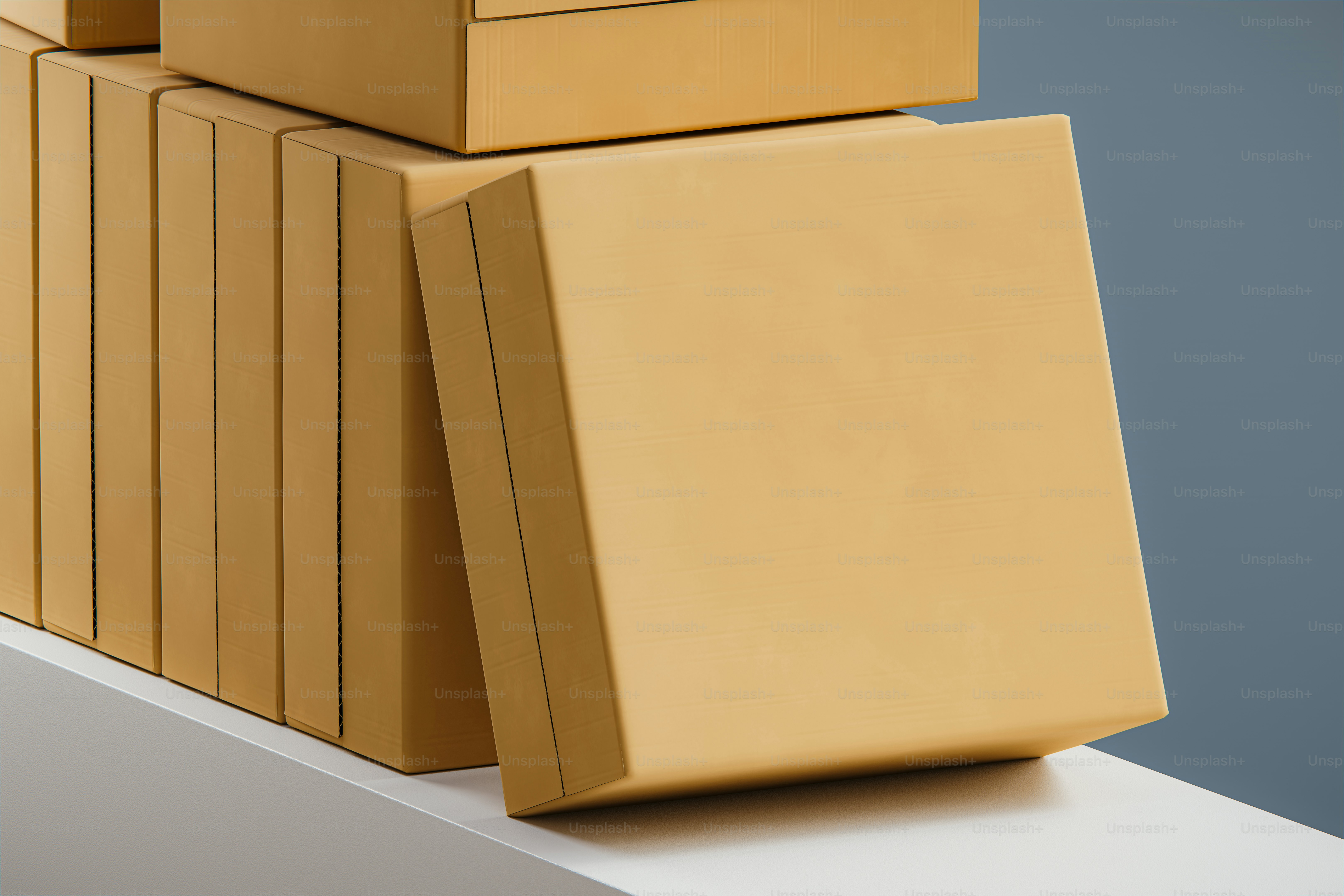 Stack of plain brown boxes on a white surface