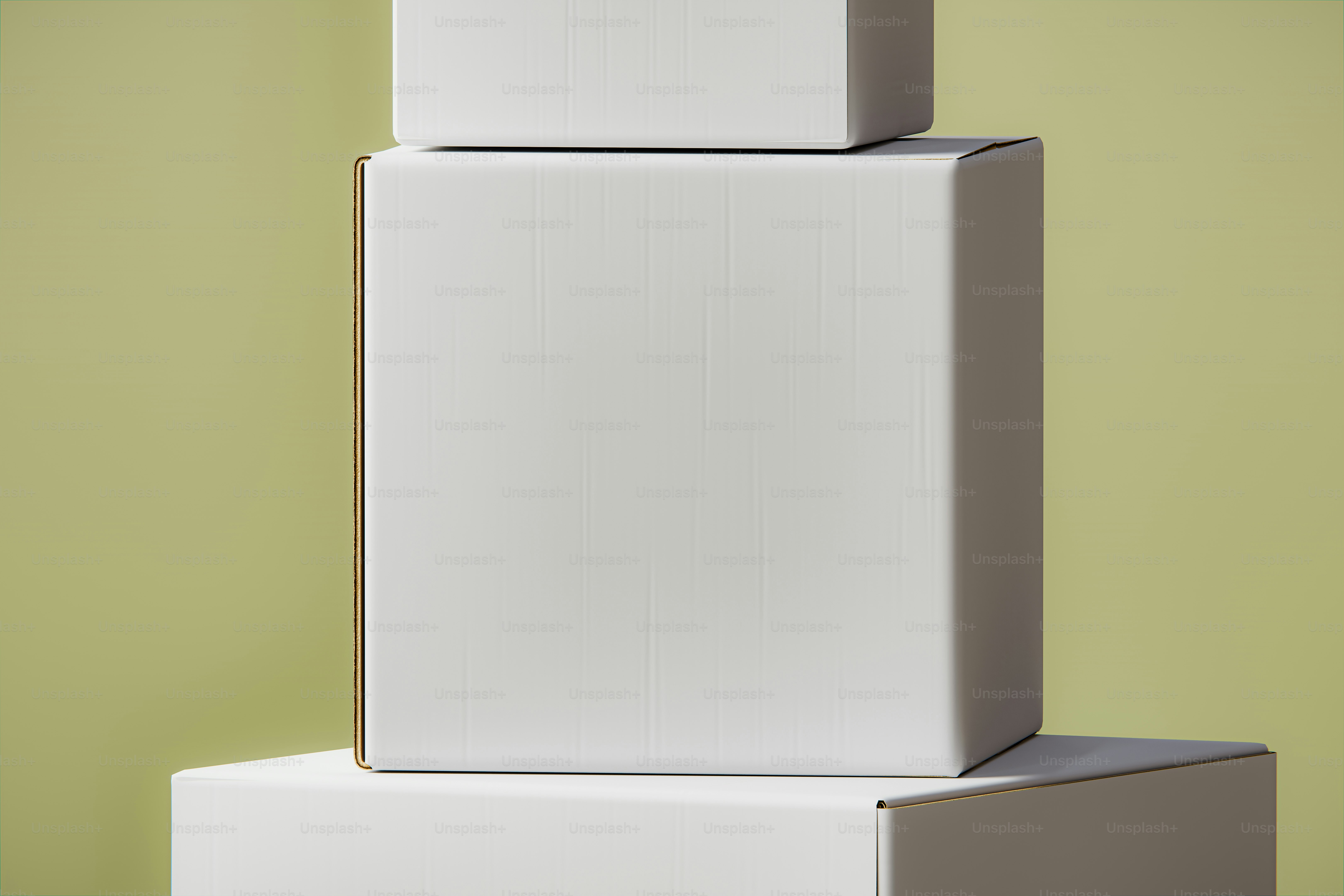 Three stacked white cubes on a pale green background