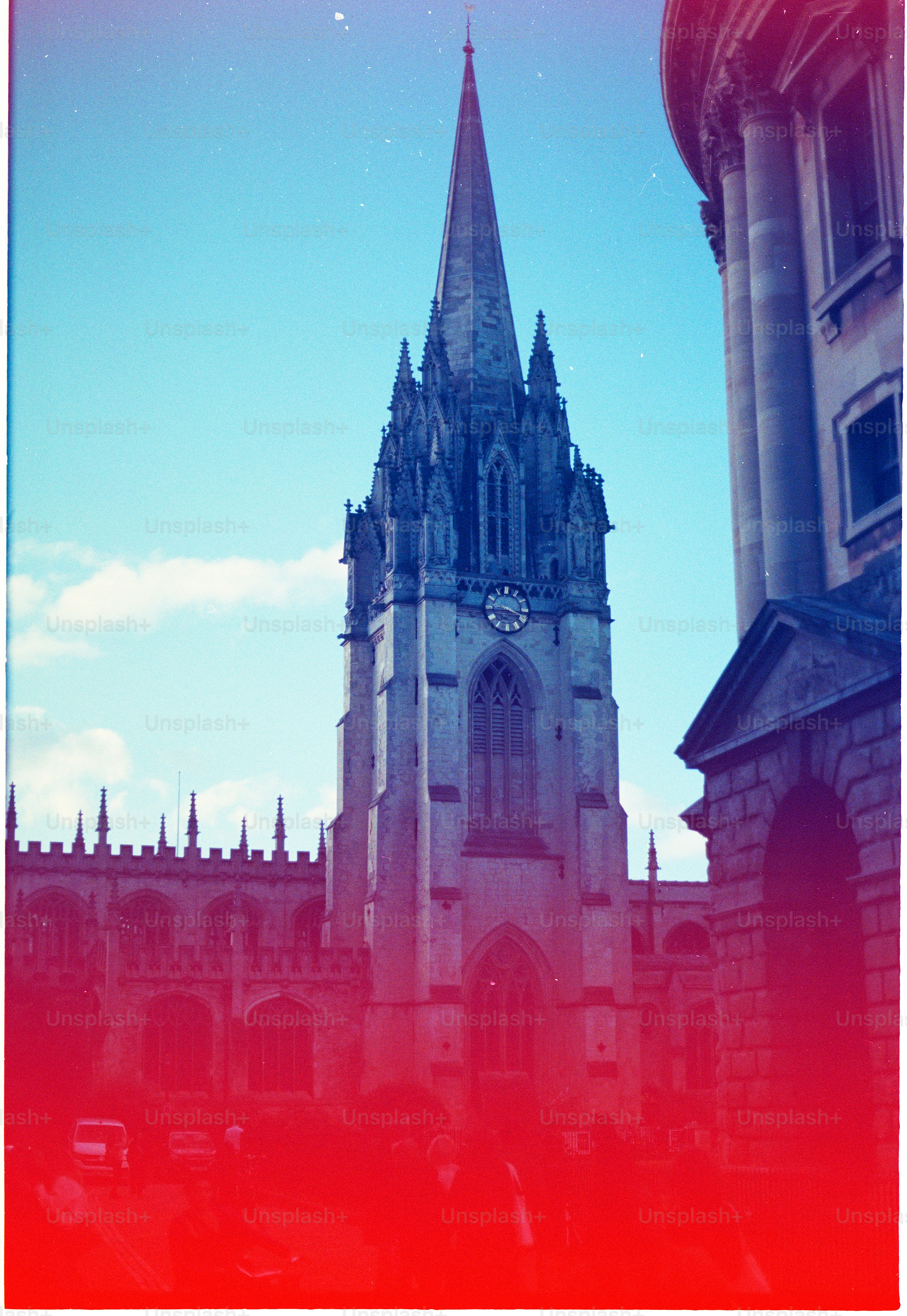 Gothic cathedral tower against a bright blue sky. photo – Cathedral ...