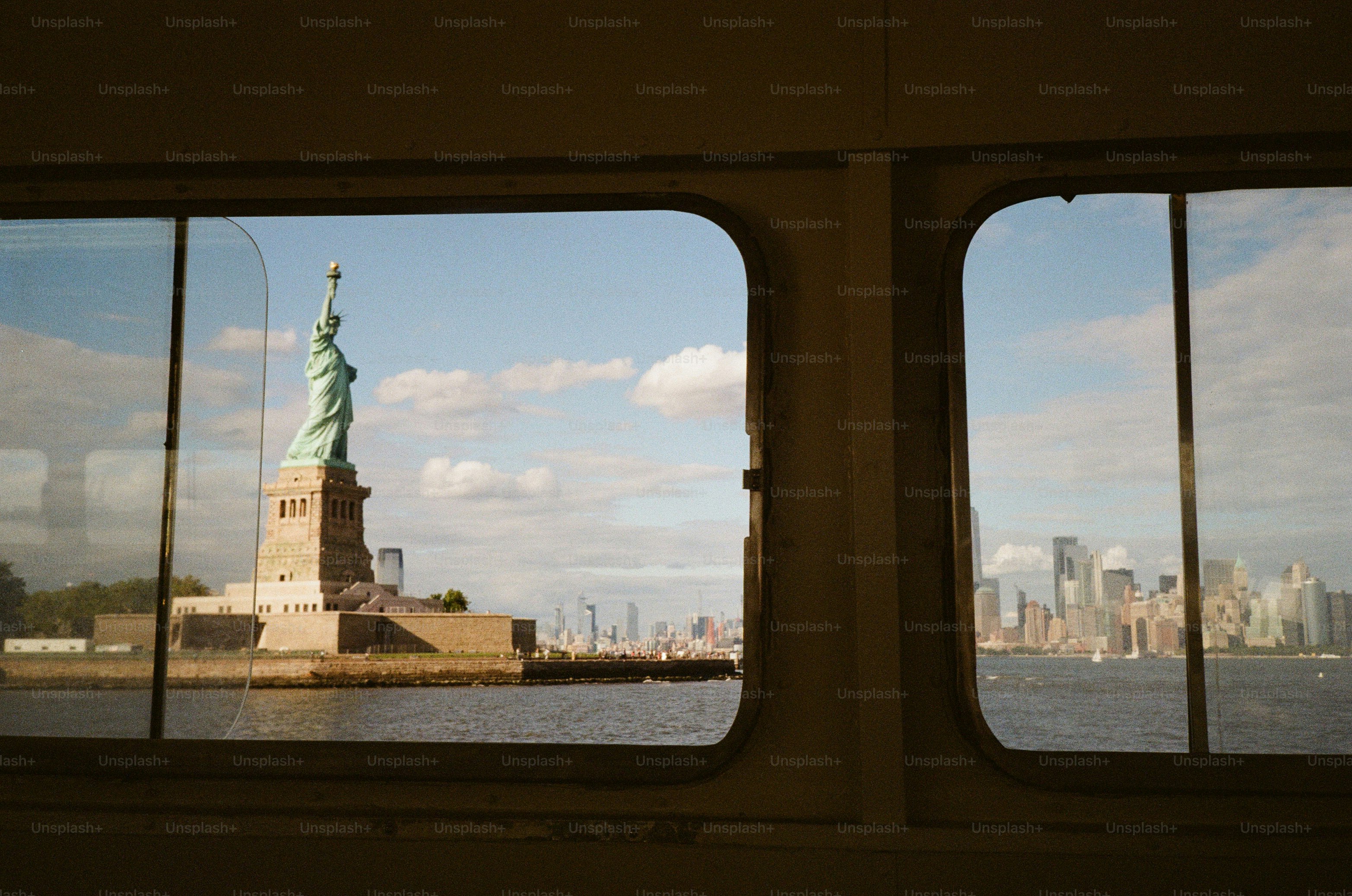 Statue of liberty viewed through ferry window