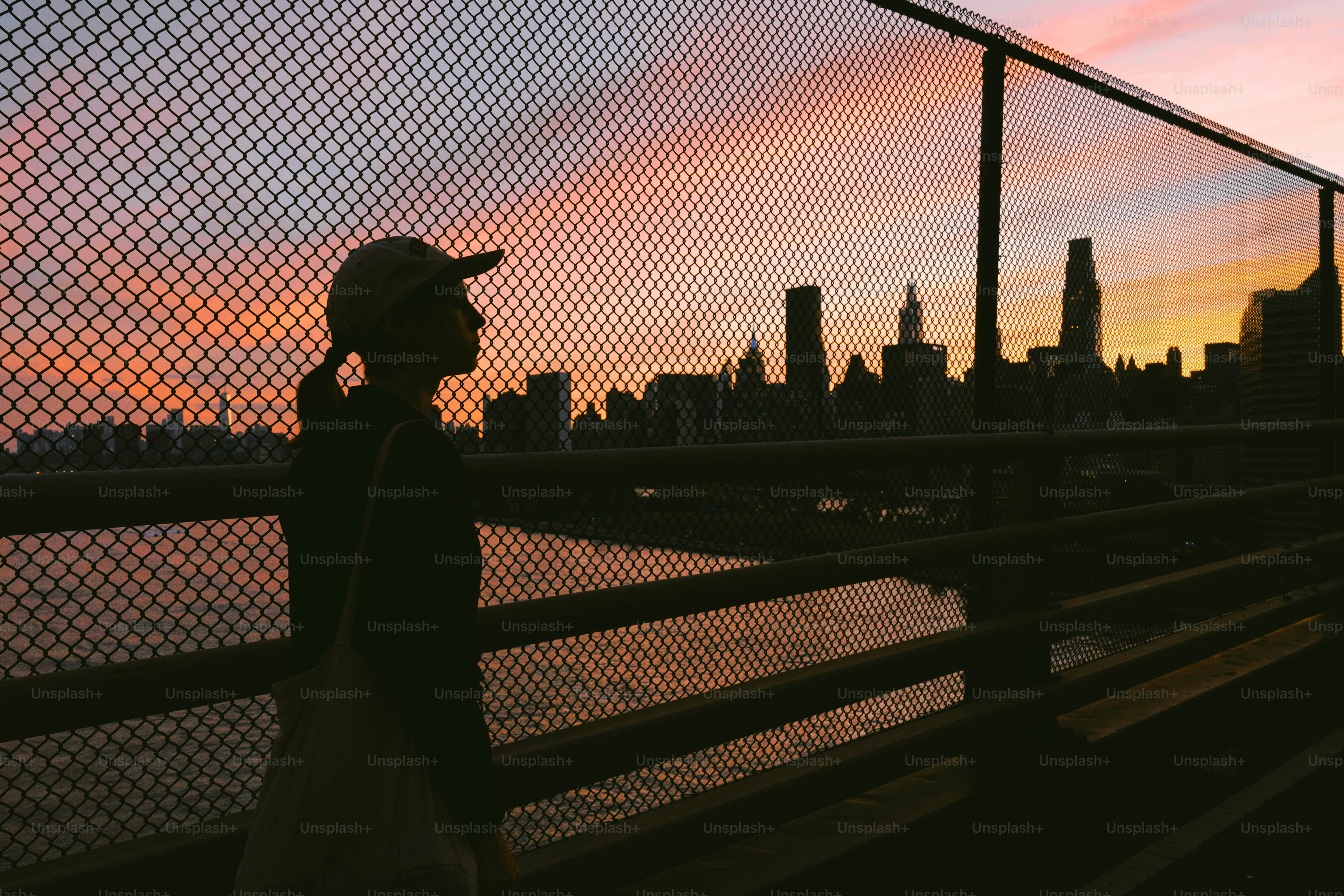 Person walking on a bridge at sunset photo – Travel Image on Unsplash