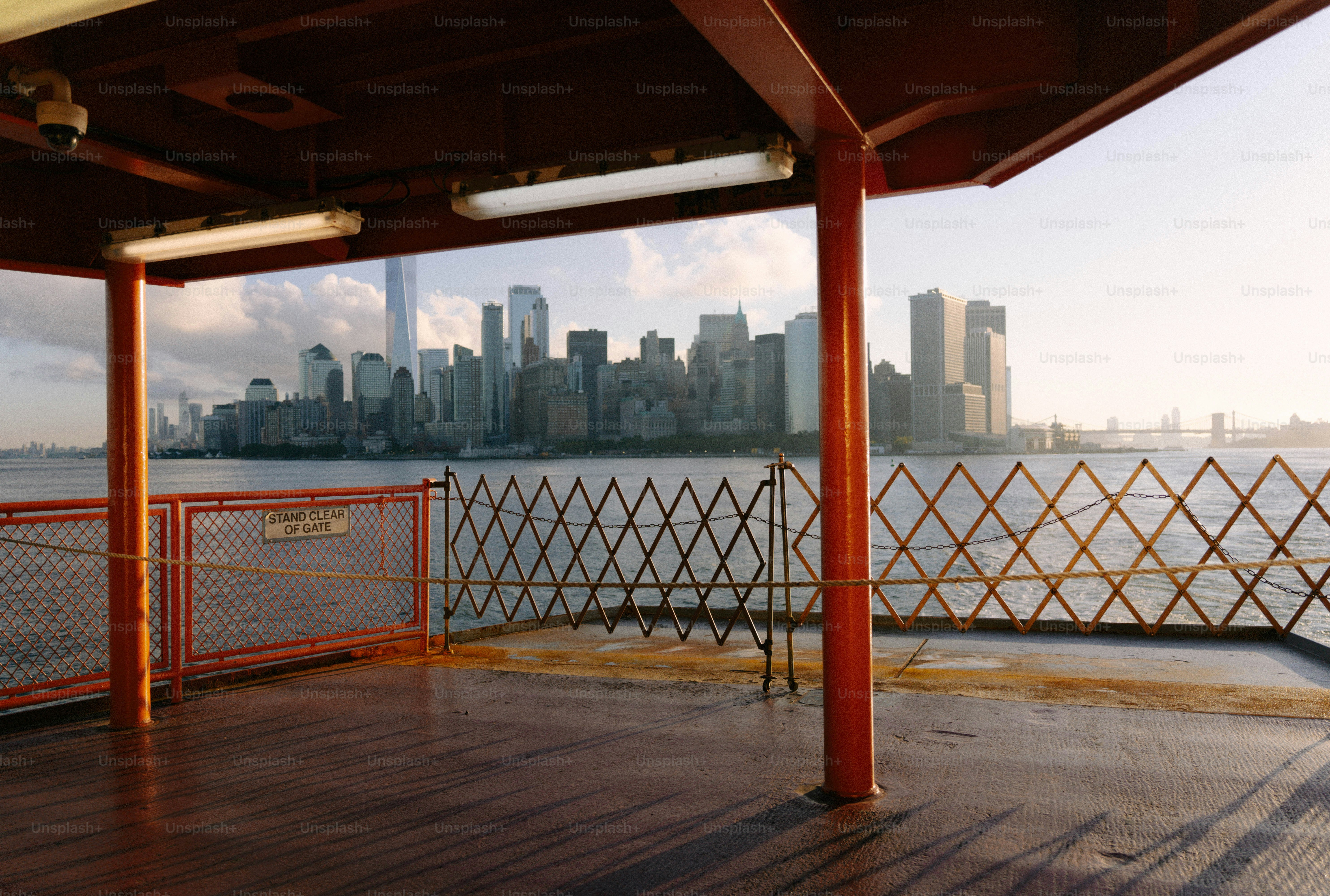 New york city skyline viewed from a ferry deck.