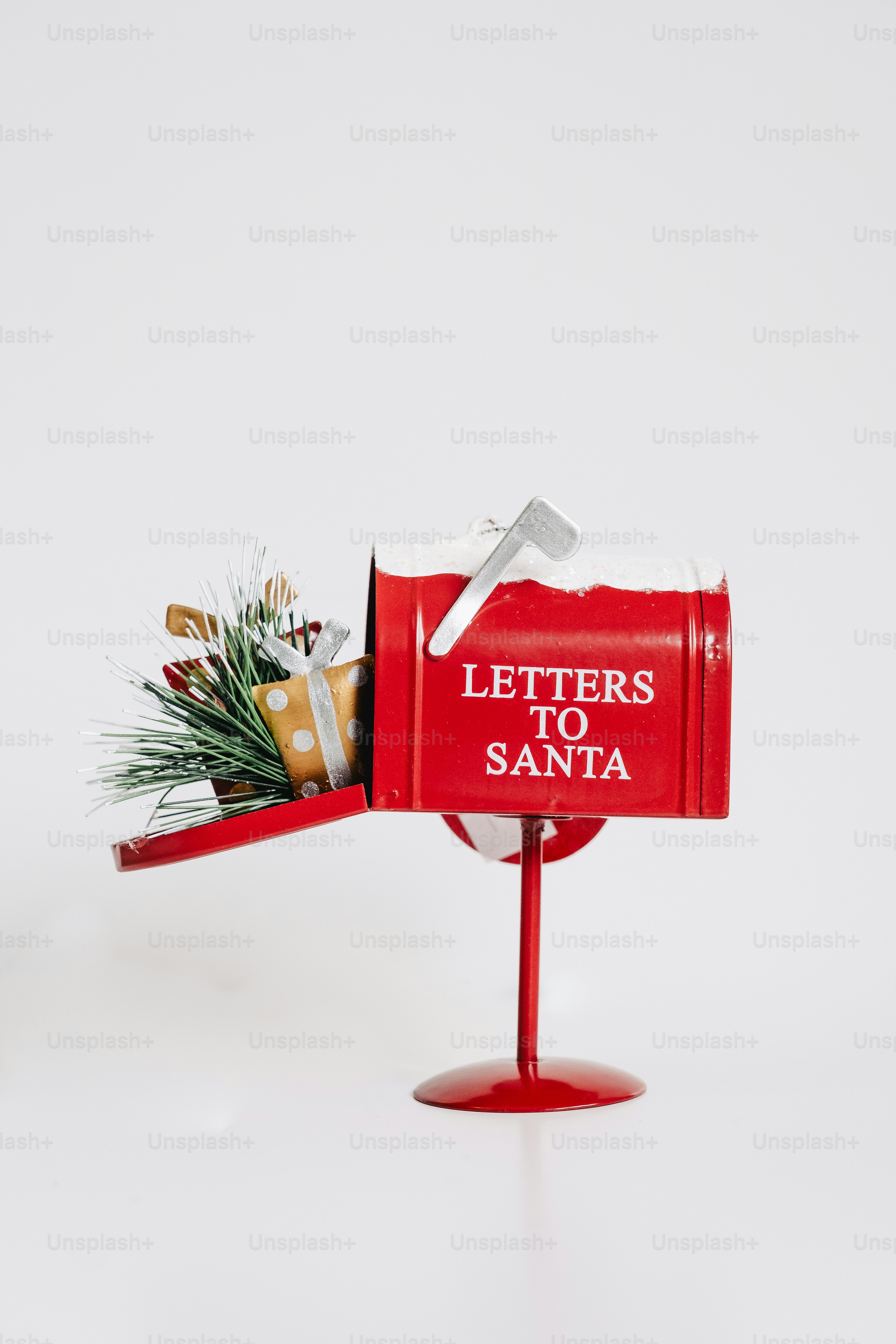 Red mailbox with 'letters to santa' and gifts