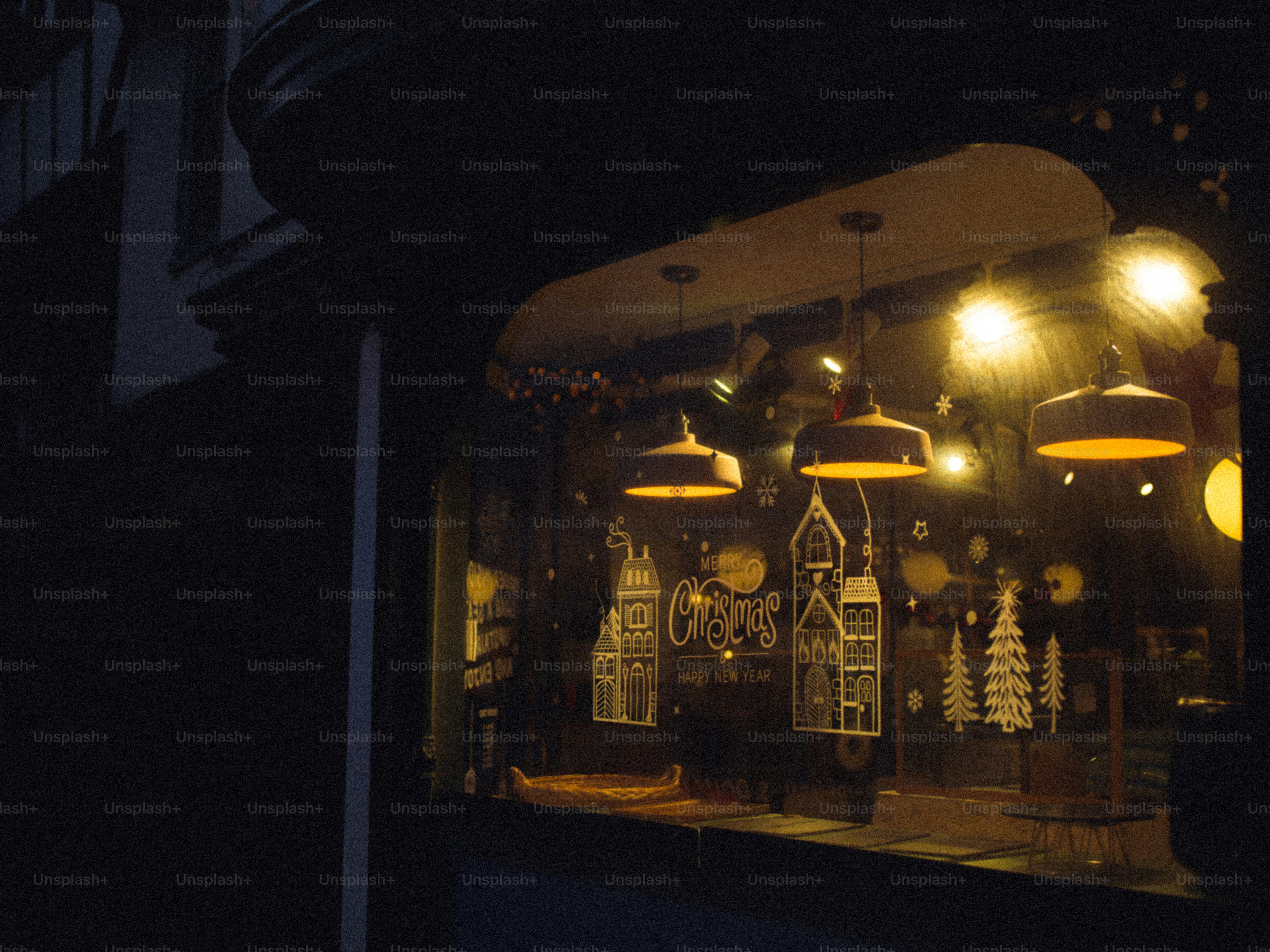 Christmas window decorations with warm lights.