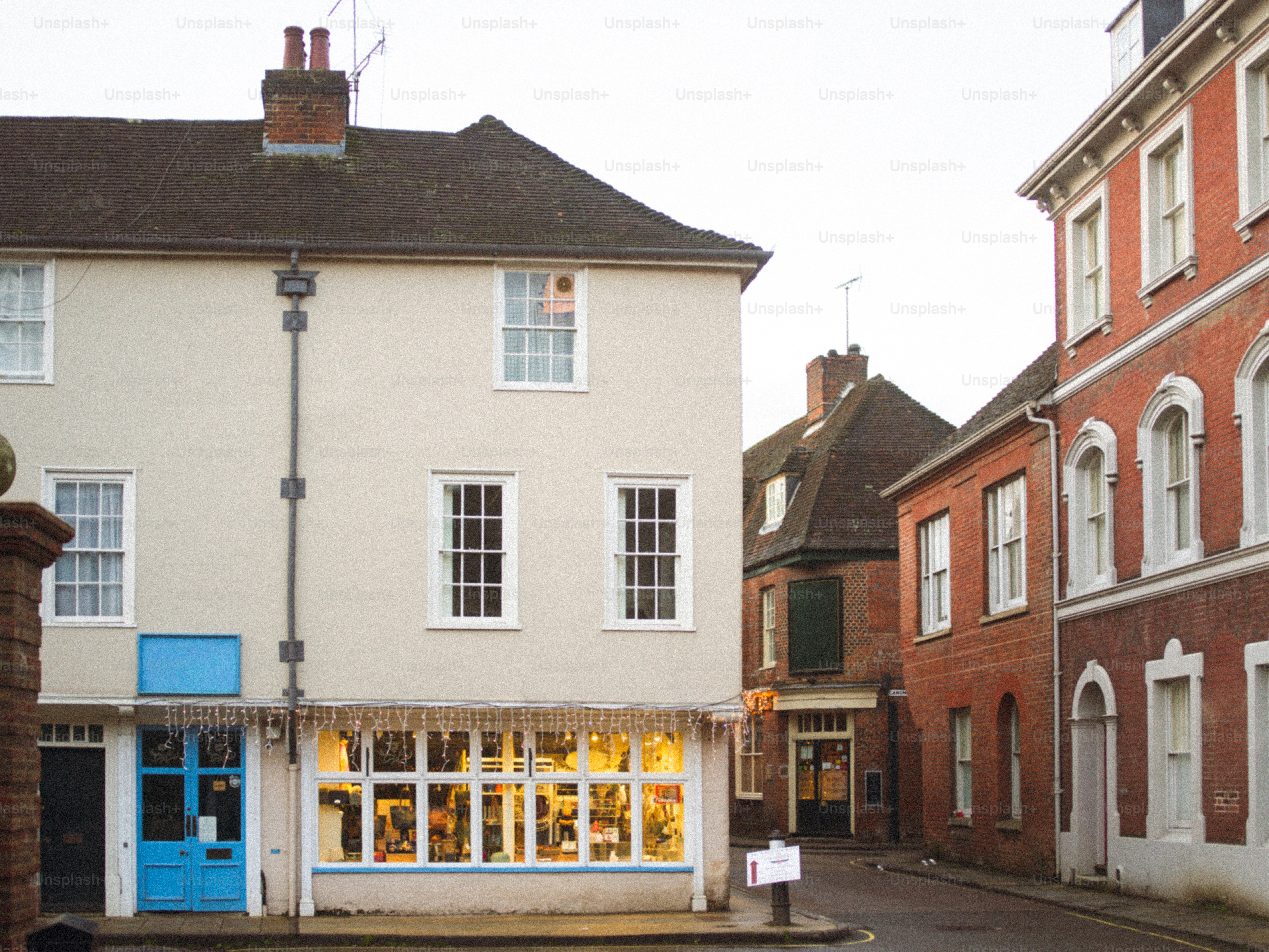 Street view of old buildings with a shop window.
