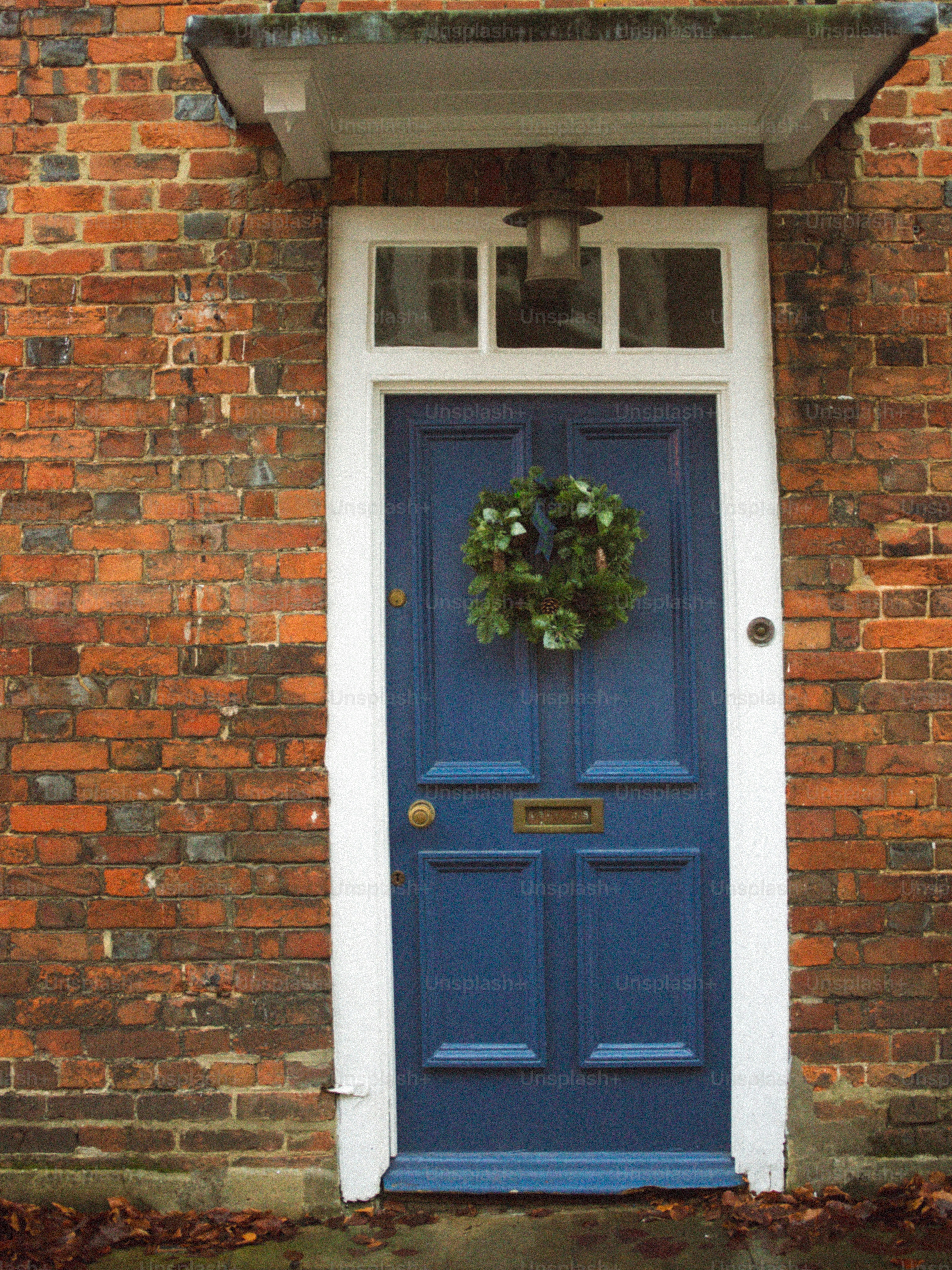 Blue front door with a green wreath