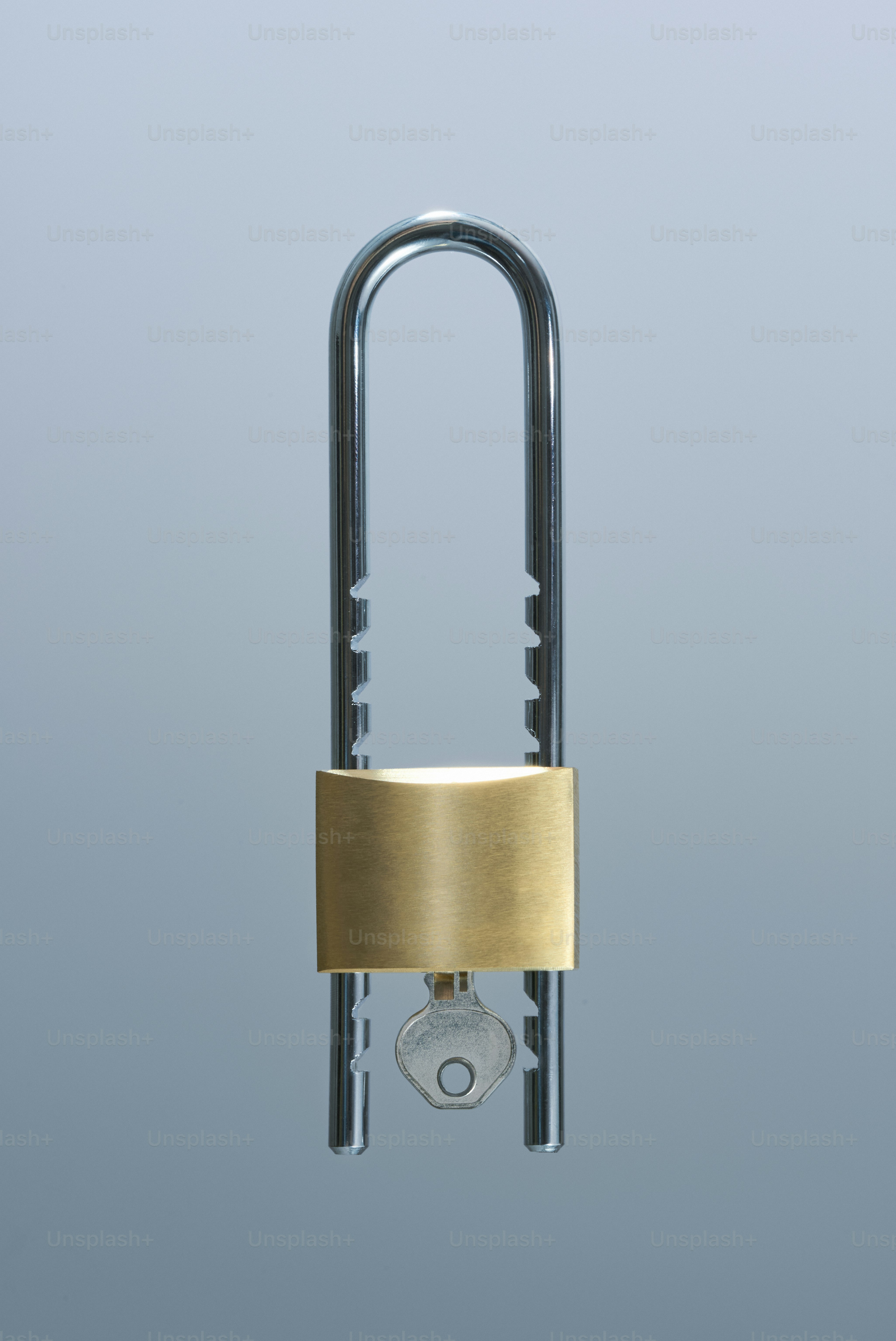 A padlock with a key in its lock.