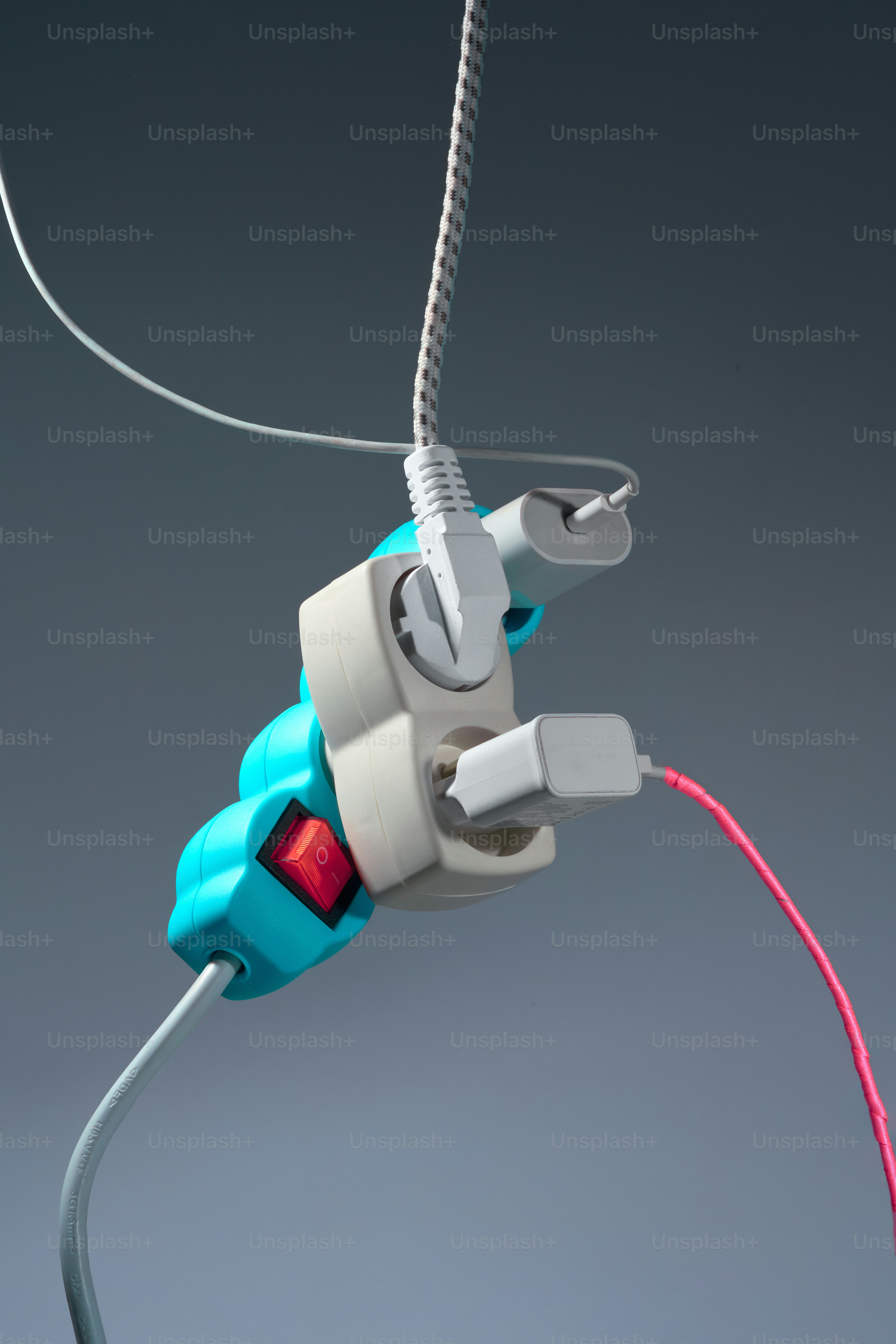 Tangled power strip with multiple plugs connected