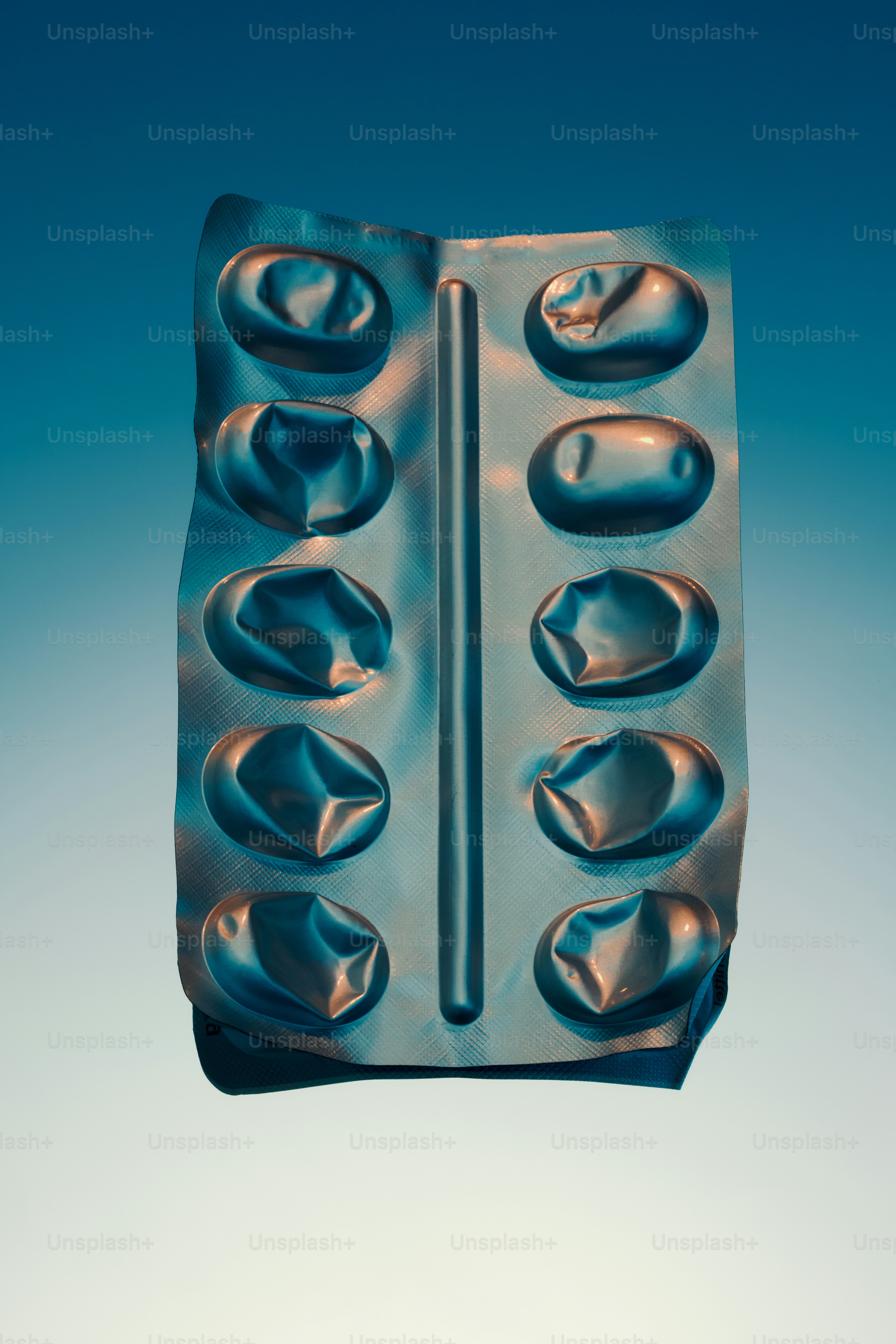 Empty blister pack of pills on a blue background