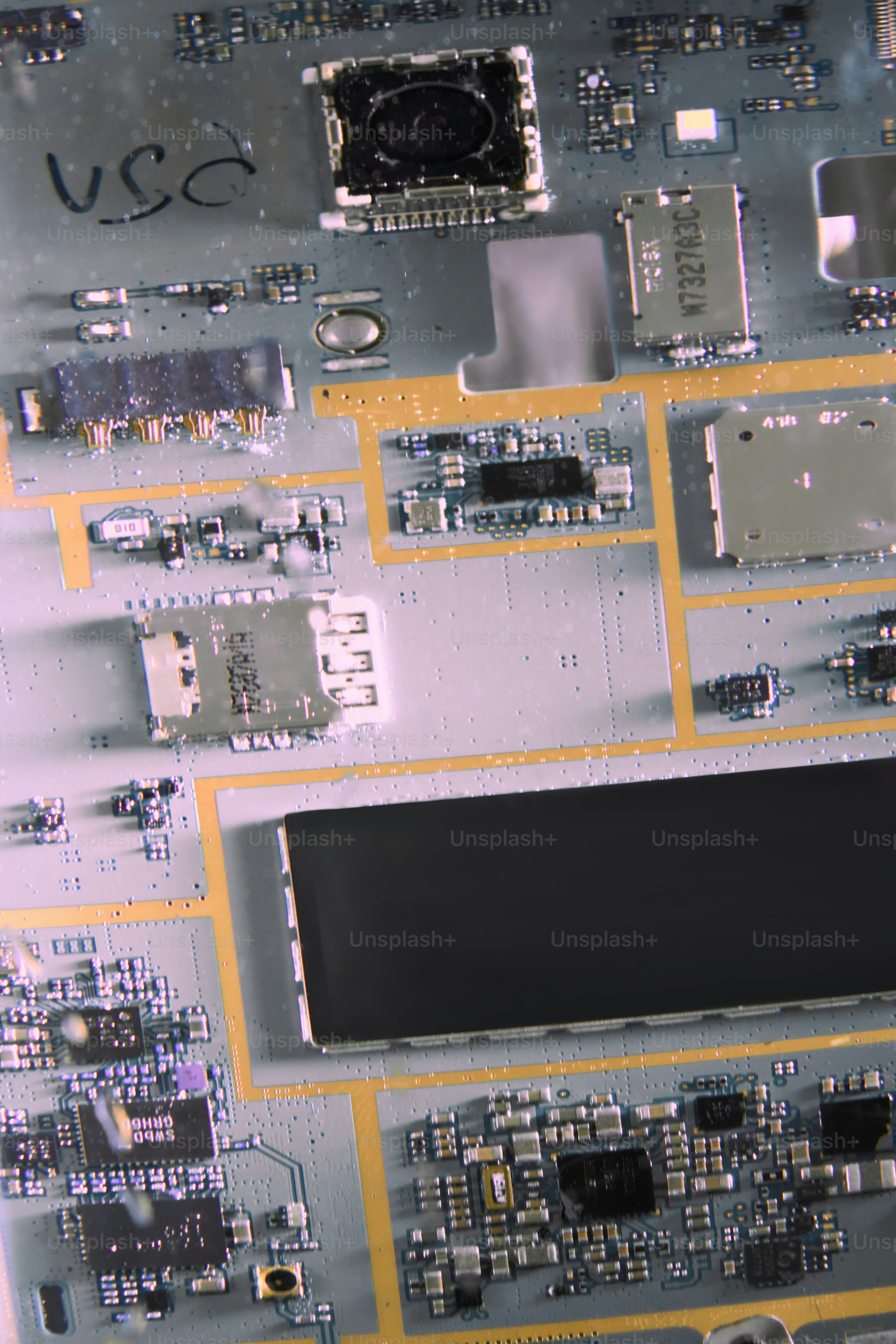 Close-up of a complex electronic circuit board with many components.