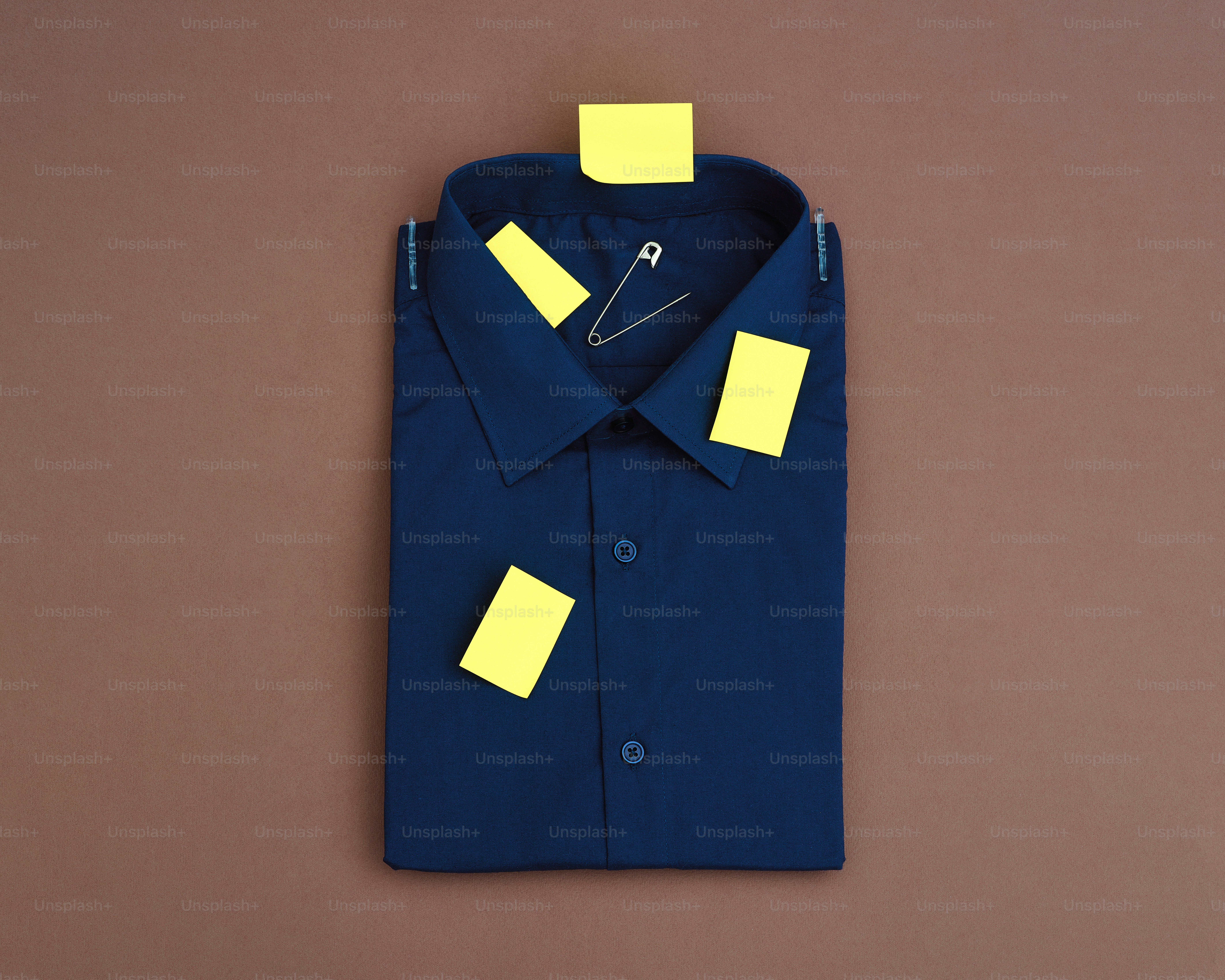 A navy blue shirt with yellow sticky notes.