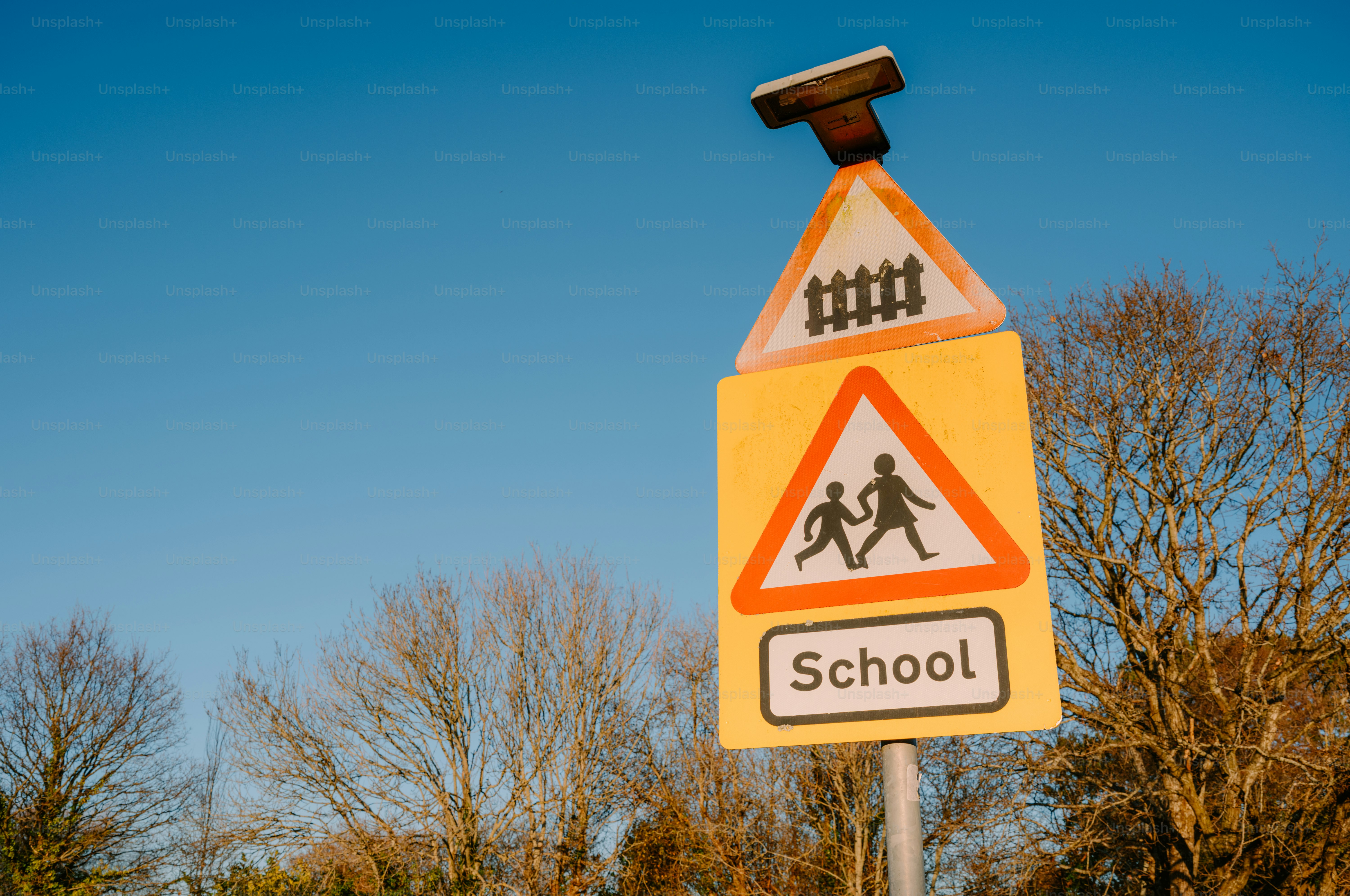 School crossing sign with railroad warning