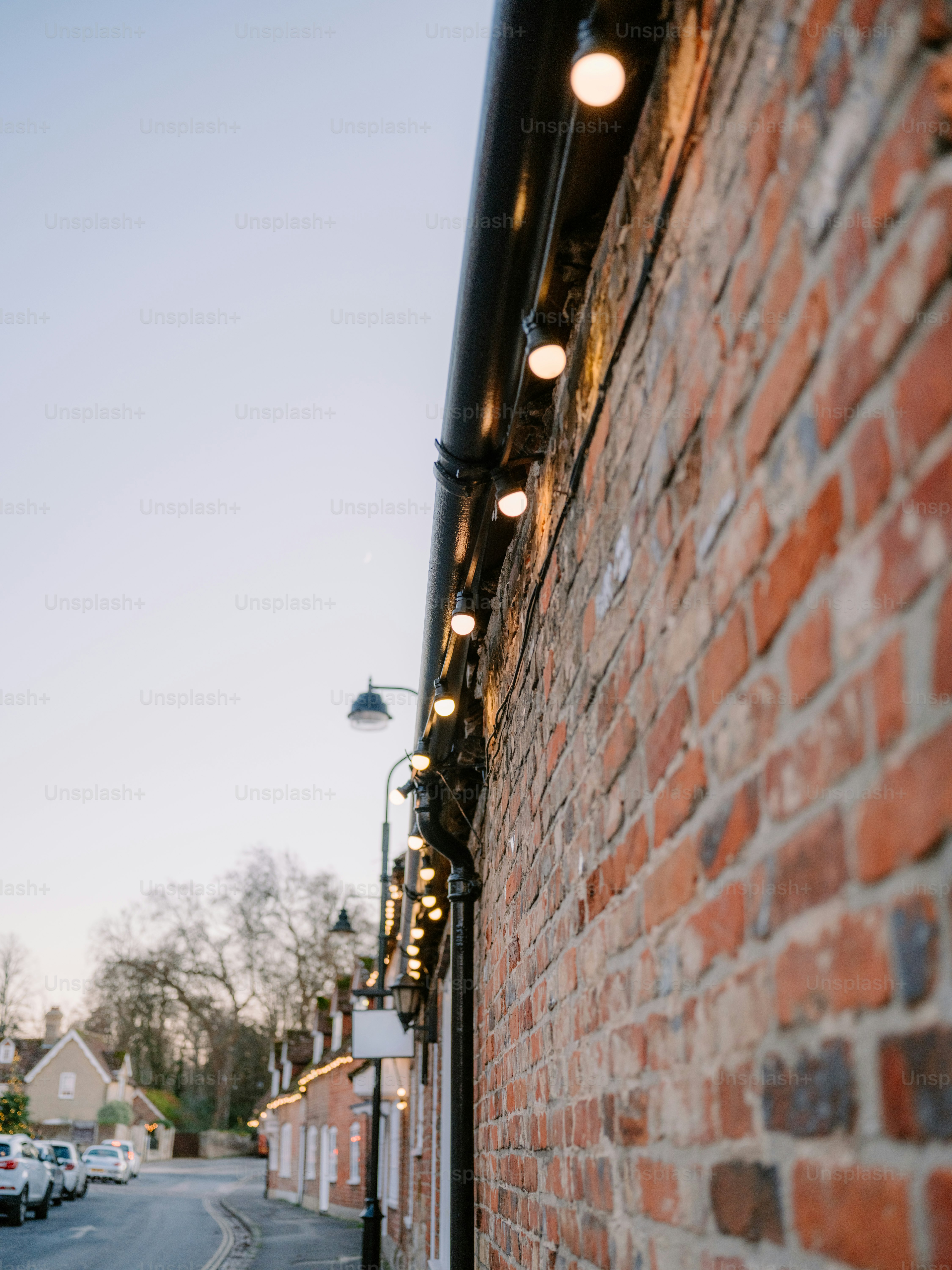 String lights adorn brick building wall