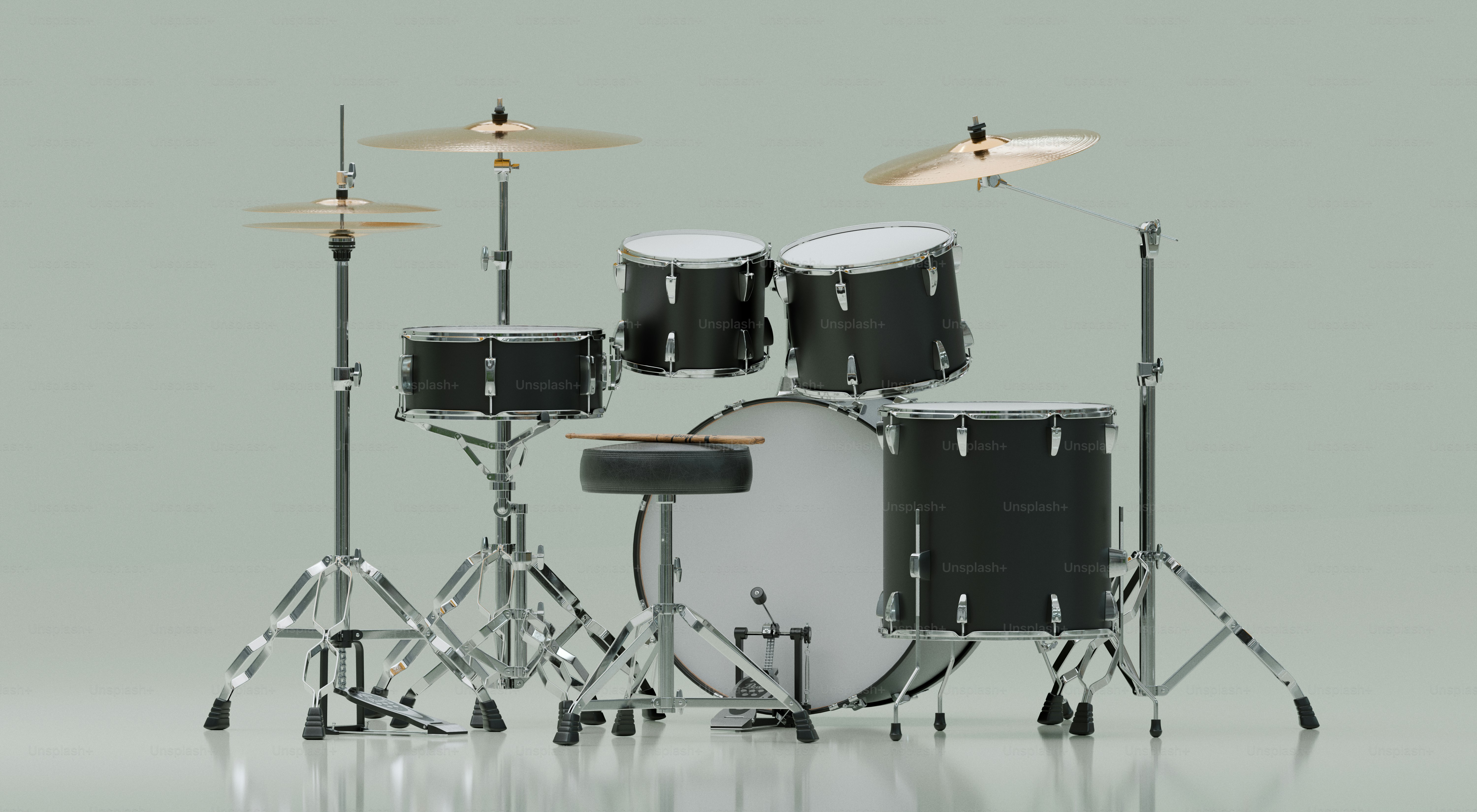 A black drum set with cymbals and stool.