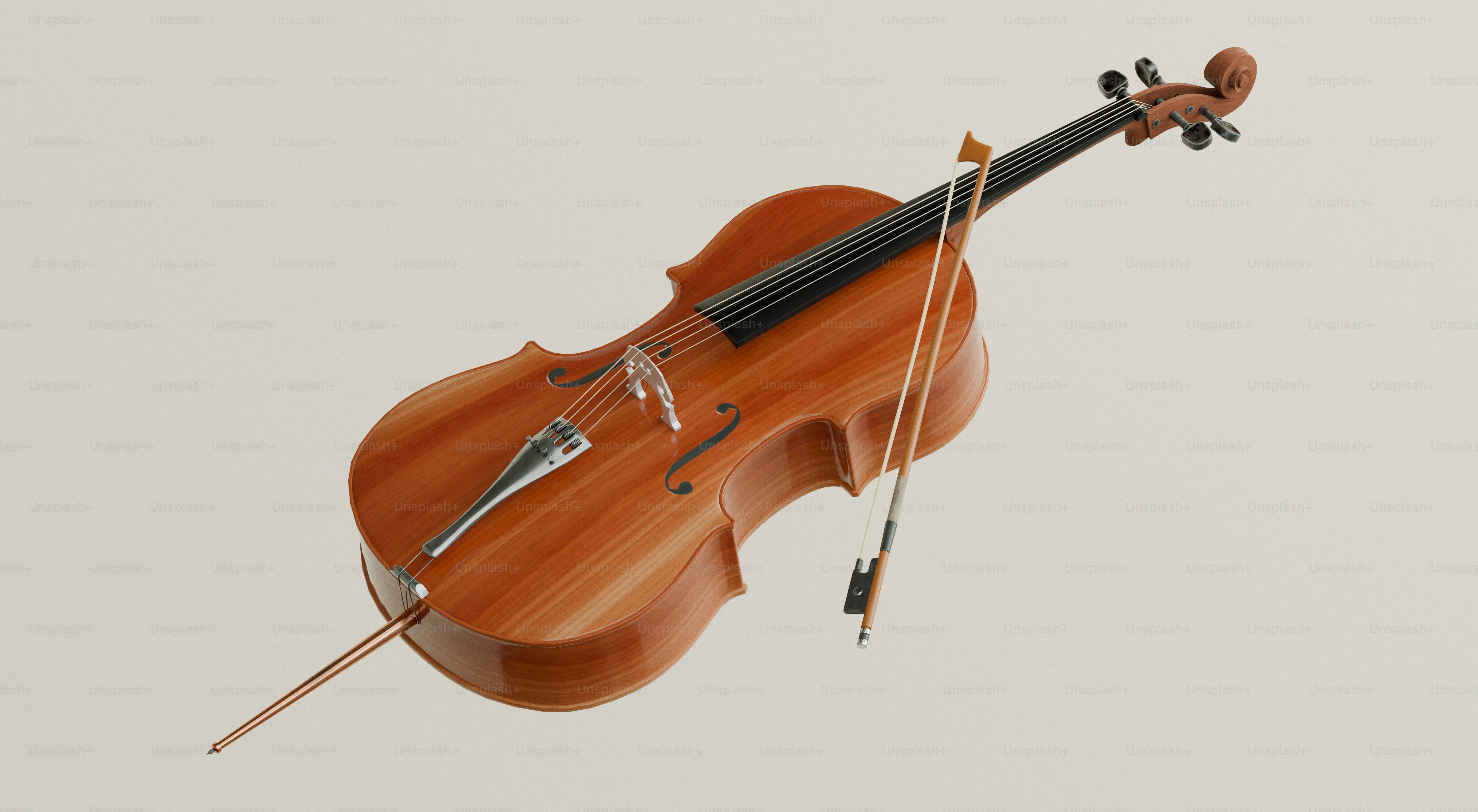 A wooden cello with a bow on a plain background