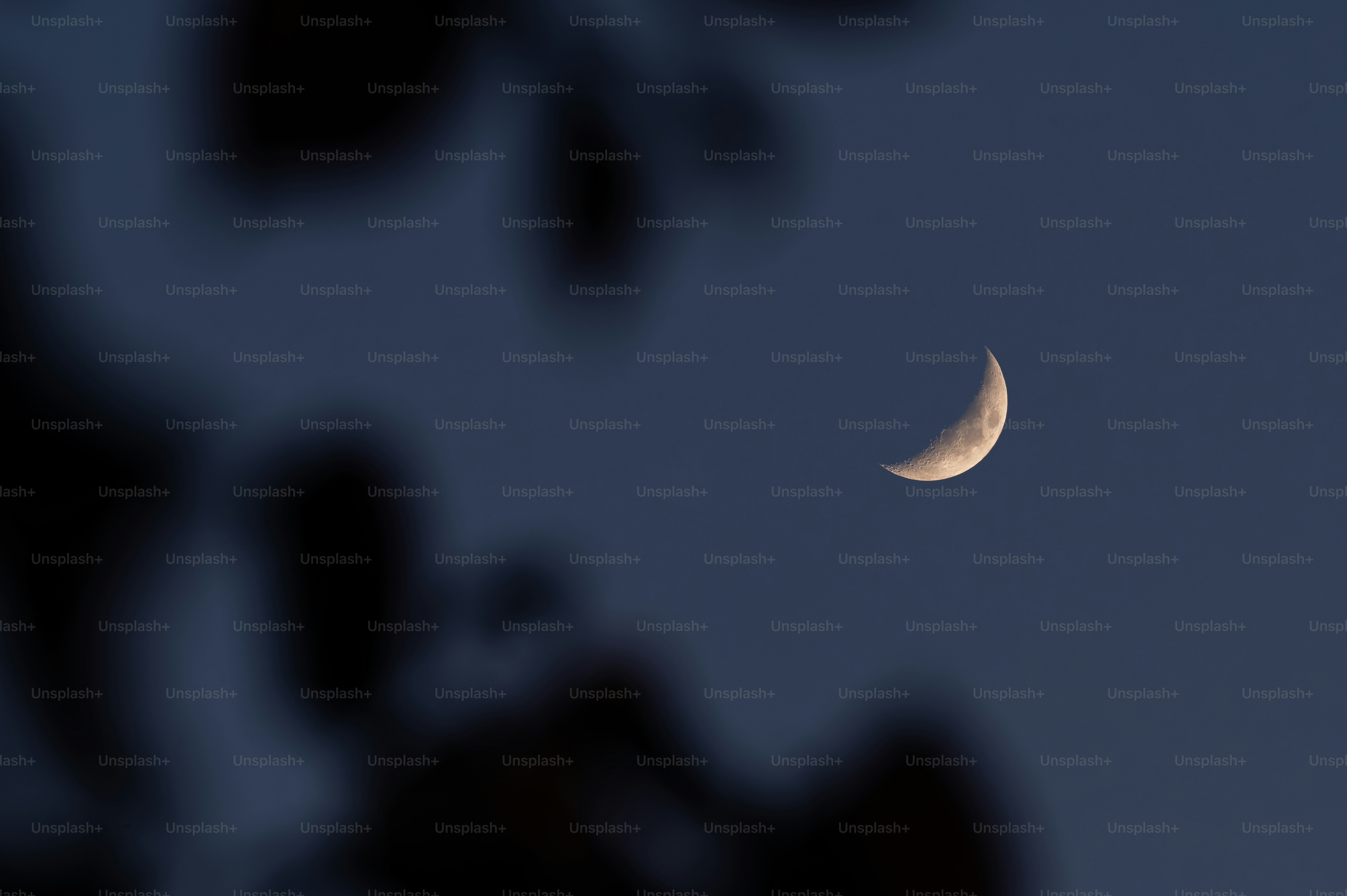 Crescent moon in a dark blue sky