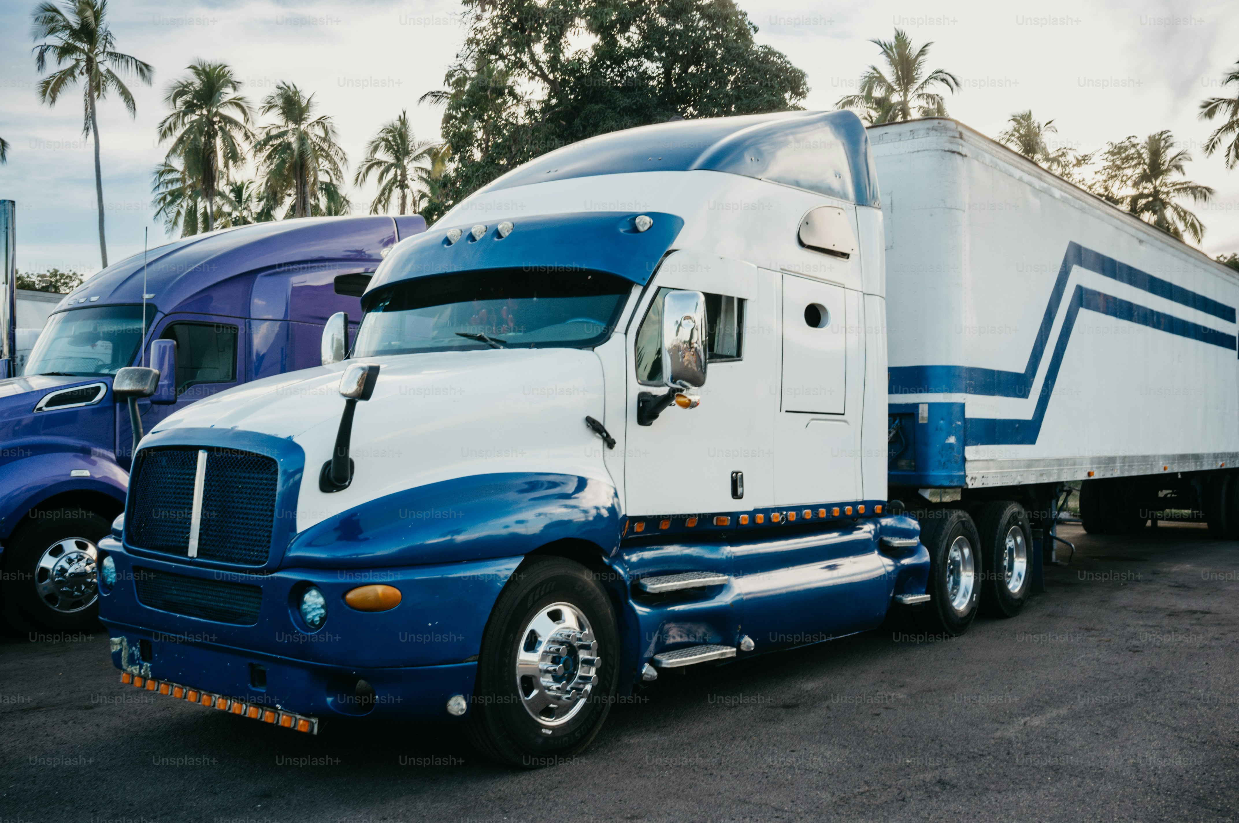 Two semi-trucks parked side by side
